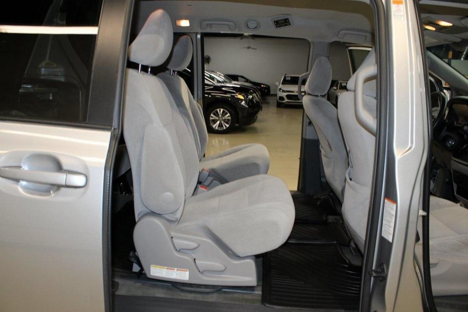 2015 Silver Sky Metallic /Ash Toyota Sienna LE (5TDJK3DC0FS) with an 3.5L V6 SMPI DOHC engine, Automatic transmission, located at 15300 Midway Rd., Addison, TX, 75001, (972) 702-0011, 32.958321, -96.838074 - 2015 Toyota Sienna XLE AWD<br>Now Available at Midway Auto Group Addison, Texas<br><br>Family-focused, feature-rich, and built to lastthe 2015 Toyota Sienna XLE AWD brings together minivan practicality with premium comfort and all-weather confidence. Whether you're navigating DFW traffic or heading - Photo#15