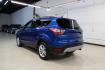 2018 Lightning Blue /Charcoal Black Ford Escape SE (1FMCU9GD6JU) with an EcoBoost 2.0L I4 GTDi DOHC Turbocharged VCT engine, Automatic transmission, located at 15300 Midway Rd., Addison, TX, 75001, (972) 702-0011, 32.958321, -96.838074 - 2018 Ford Escape SE<br>Now Available at Midway Auto Group Addison, Texas<br><br>Stylish, versatile, and packed with features, the 2018 Ford Escape SE offers a confident driving experience thats perfect for both urban commutes and weekend getaways. With its turbocharged performance, smart technology - Photo#3
