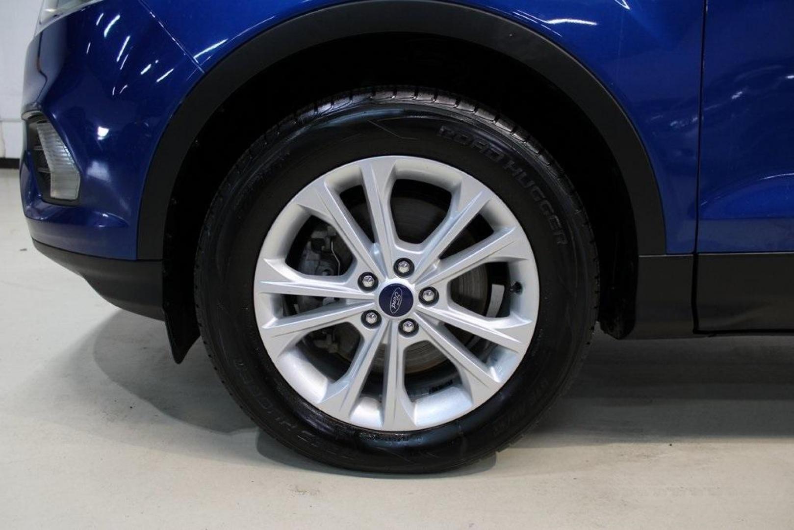 2018 Lightning Blue /Charcoal Black Ford Escape SE (1FMCU9GD6JU) with an EcoBoost 2.0L I4 GTDi DOHC Turbocharged VCT engine, Automatic transmission, located at 15300 Midway Rd., Addison, TX, 75001, (972) 702-0011, 32.958321, -96.838074 - 2018 Ford Escape SE<br>Now Available at Midway Auto Group Addison, Texas<br><br>Stylish, versatile, and packed with features, the 2018 Ford Escape SE offers a confident driving experience thats perfect for both urban commutes and weekend getaways. With its turbocharged performance, smart technology - Photo#8