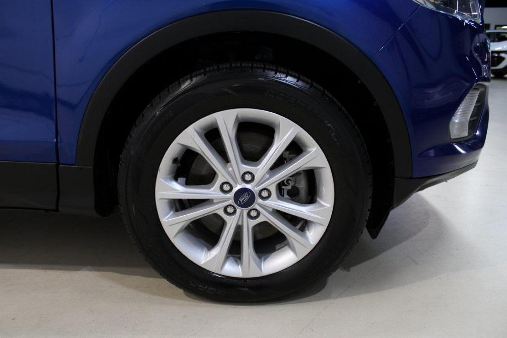 2018 Lightning Blue /Charcoal Black Ford Escape SE (1FMCU9GD6JU) with an EcoBoost 2.0L I4 GTDi DOHC Turbocharged VCT engine, Automatic transmission, located at 15300 Midway Rd., Addison, TX, 75001, (972) 702-0011, 32.958321, -96.838074 - 2018 Ford Escape SE<br>Now Available at Midway Auto Group Addison, Texas<br><br>Stylish, versatile, and packed with features, the 2018 Ford Escape SE offers a confident driving experience thats perfect for both urban commutes and weekend getaways. With its turbocharged performance, smart technology - Photo#11