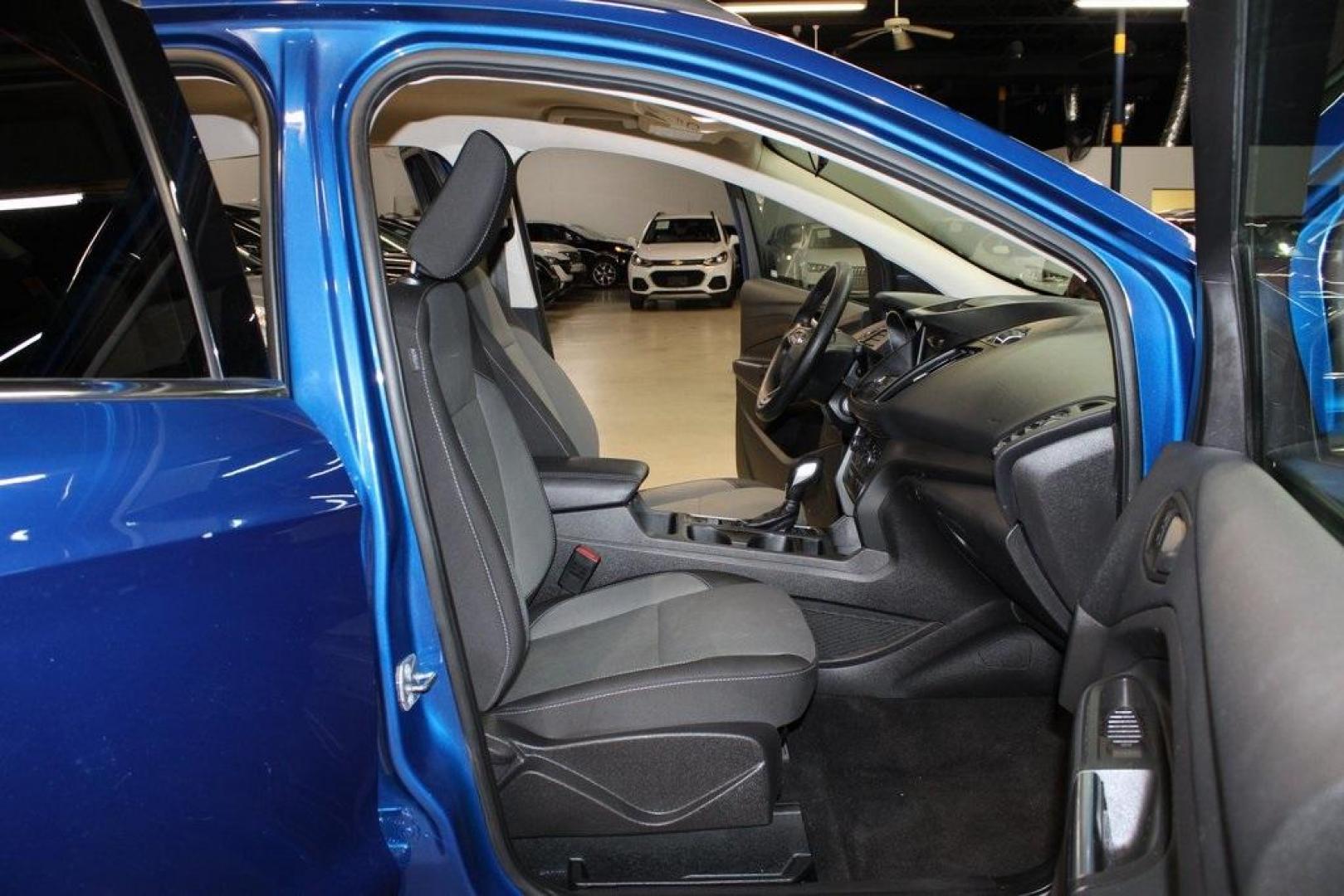2018 Lightning Blue /Charcoal Black Ford Escape SE (1FMCU9GD6JU) with an EcoBoost 2.0L I4 GTDi DOHC Turbocharged VCT engine, Automatic transmission, located at 15300 Midway Rd., Addison, TX, 75001, (972) 702-0011, 32.958321, -96.838074 - 2018 Ford Escape SE<br>Now Available at Midway Auto Group Addison, Texas<br><br>Stylish, versatile, and packed with features, the 2018 Ford Escape SE offers a confident driving experience thats perfect for both urban commutes and weekend getaways. With its turbocharged performance, smart technology - Photo#14