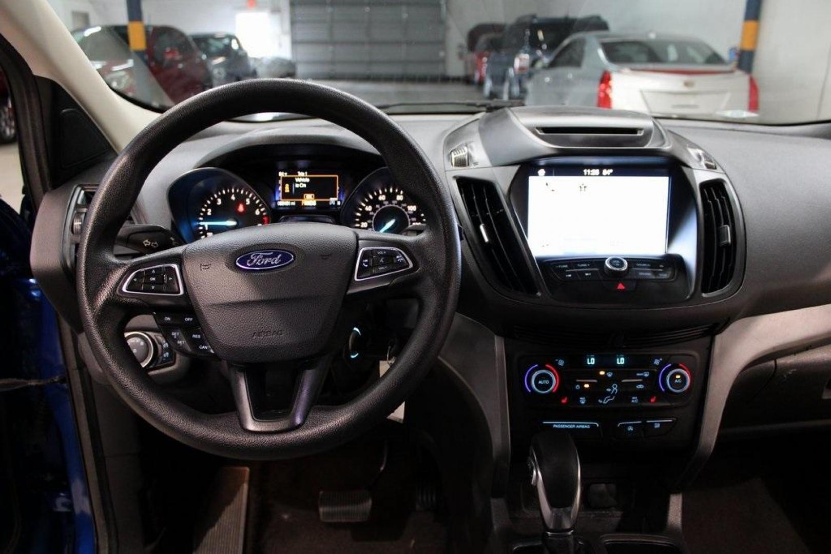 2018 Lightning Blue /Charcoal Black Ford Escape SE (1FMCU9GD6JU) with an EcoBoost 2.0L I4 GTDi DOHC Turbocharged VCT engine, Automatic transmission, located at 15300 Midway Rd., Addison, TX, 75001, (972) 702-0011, 32.958321, -96.838074 - 2018 Ford Escape SE<br>Now Available at Midway Auto Group Addison, Texas<br><br>Stylish, versatile, and packed with features, the 2018 Ford Escape SE offers a confident driving experience thats perfect for both urban commutes and weekend getaways. With its turbocharged performance, smart technology - Photo#17