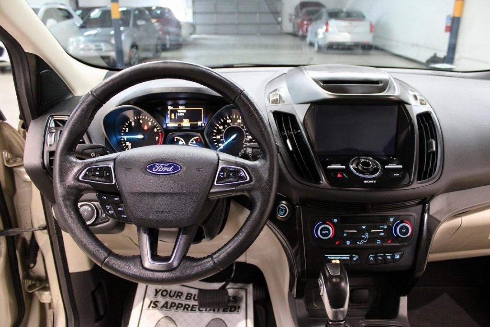 2018 White Gold /Medium Light Stone Ford Escape Titanium (1FMCU0J90JU) with an EcoBoost 2.0L I4 GTDi DOHC Turbocharged VCT engine, Automatic transmission, located at 15300 Midway Rd., Addison, TX, 75001, (972) 702-0011, 32.958321, -96.838074 - Photo#16