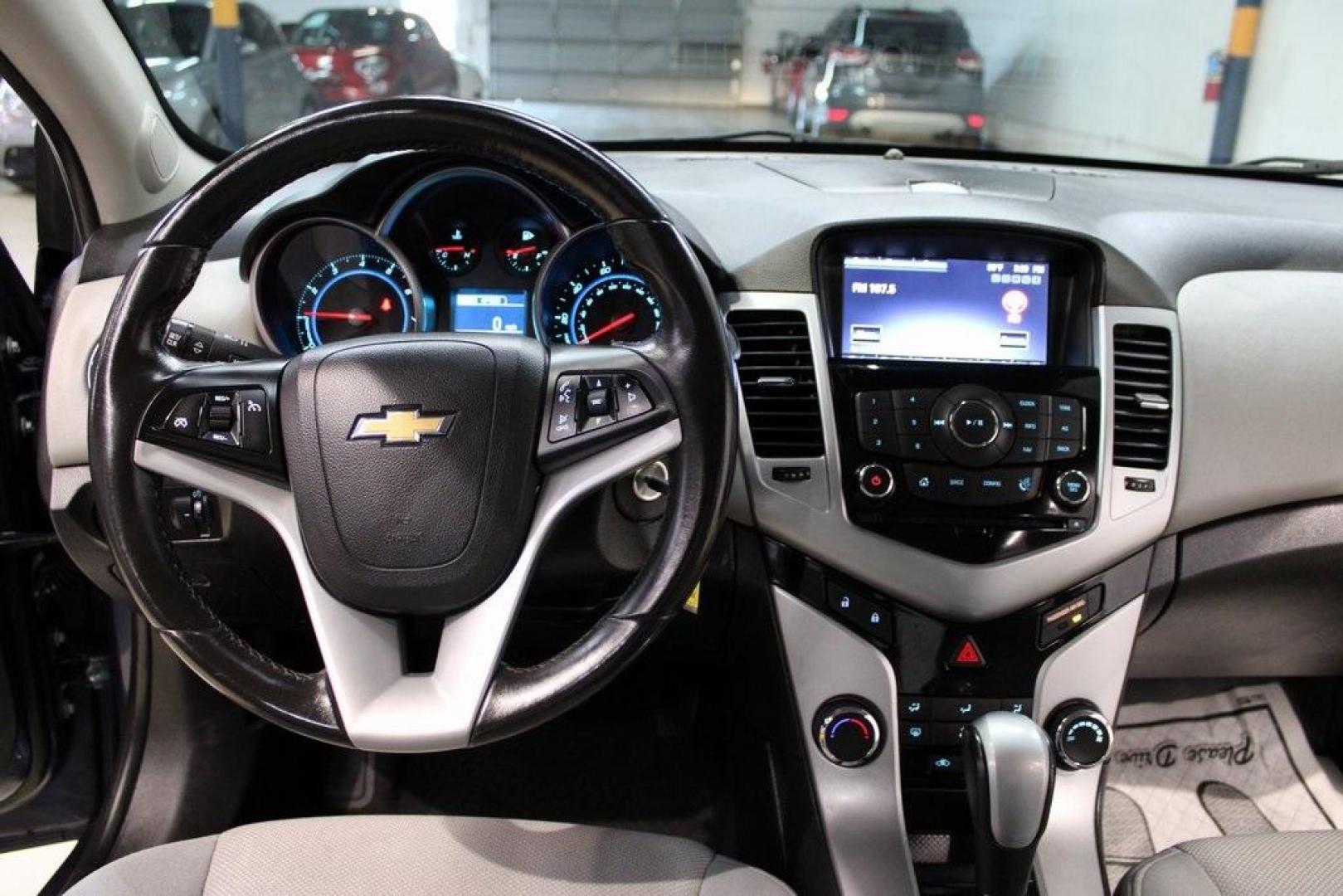 2014 Atlantis Blue Metallic /Medium Titanium Chevrolet Cruze 1LT (1G1PC5SB7E7) with an ECOTEC 1.4L I4 SMPI DOHC Turbocharged VVT engine, Automatic transmission, located at 15300 Midway Rd., Addison, TX, 75001, (972) 702-0011, 32.958321, -96.838074 - Photo#16