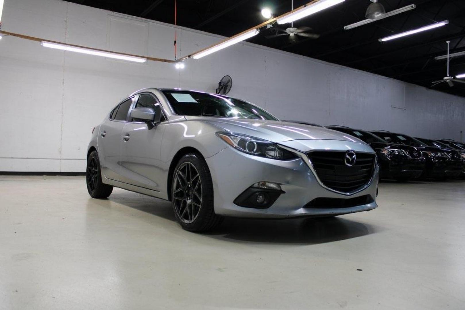 2015 Liquid Silver Metallic /Black Mazda Mazda3 i Grand Touring (3MZBM1M74FM) with an SKYACTIV-G 2.0L 4-Cylinder DOHC 16V engine, Manual transmission, located at 15300 Midway Rd., Addison, TX, 75001, (972) 702-0011, 32.958321, -96.838074 - Photo#1