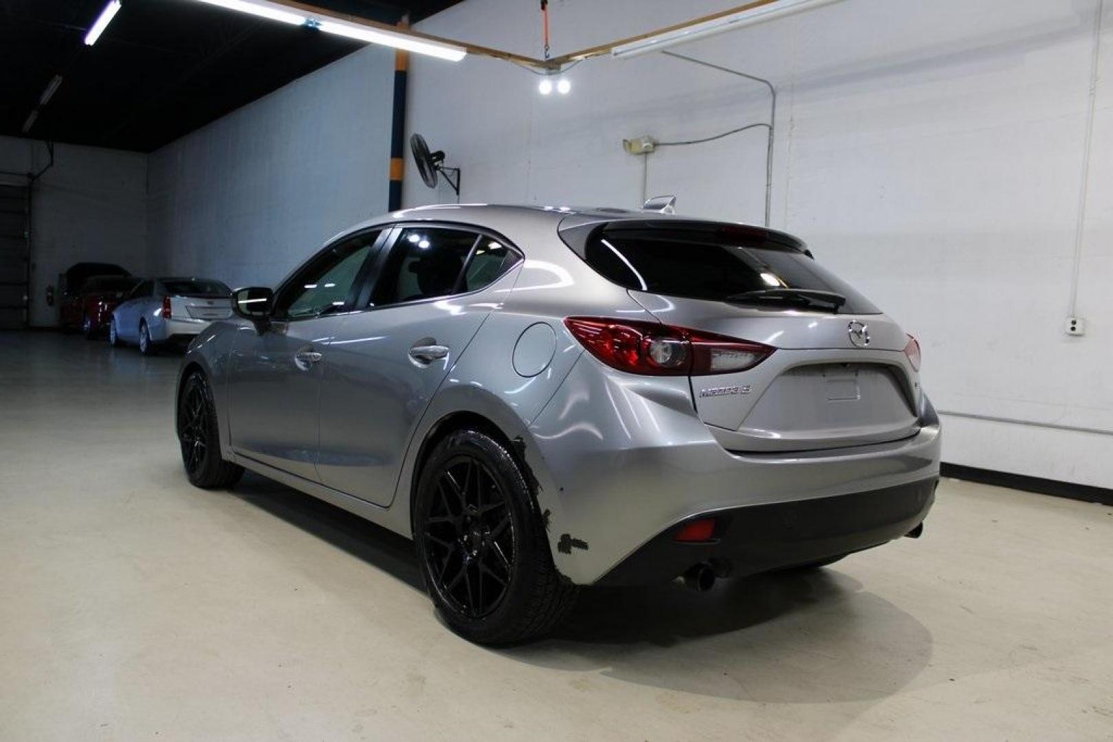 2015 Liquid Silver Metallic /Black Mazda Mazda3 i Grand Touring (3MZBM1M74FM) with an SKYACTIV-G 2.0L 4-Cylinder DOHC 16V engine, Manual transmission, located at 15300 Midway Rd., Addison, TX, 75001, (972) 702-0011, 32.958321, -96.838074 - Photo#3