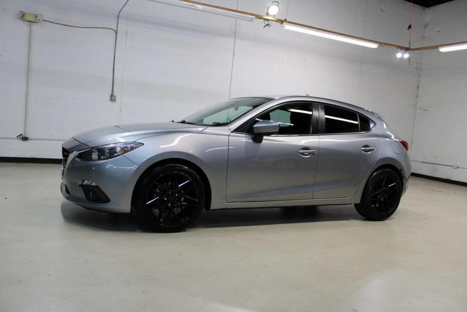 2015 Liquid Silver Metallic /Black Mazda Mazda3 i Grand Touring (3MZBM1M74FM) with an SKYACTIV-G 2.0L 4-Cylinder DOHC 16V engine, Manual transmission, located at 15300 Midway Rd., Addison, TX, 75001, (972) 702-0011, 32.958321, -96.838074 - Photo#4