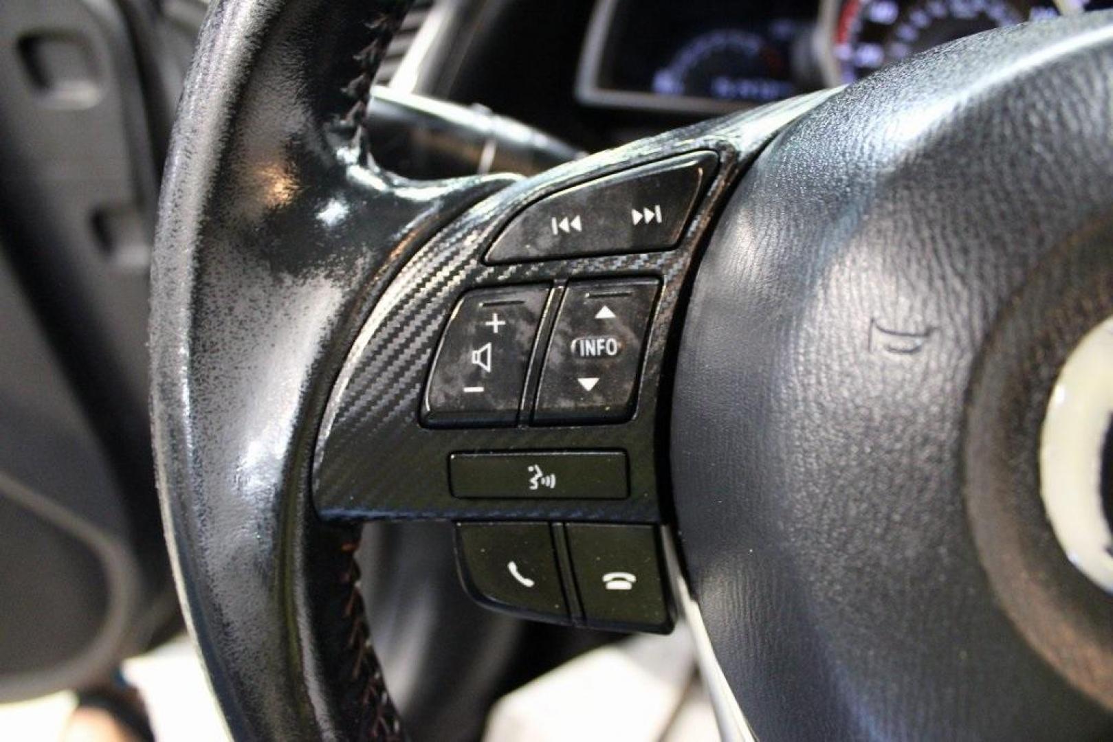 2015 Liquid Silver Metallic /Black Mazda Mazda3 i Grand Touring (3MZBM1M74FM) with an SKYACTIV-G 2.0L 4-Cylinder DOHC 16V engine, Manual transmission, located at 15300 Midway Rd., Addison, TX, 75001, (972) 702-0011, 32.958321, -96.838074 - Photo#25