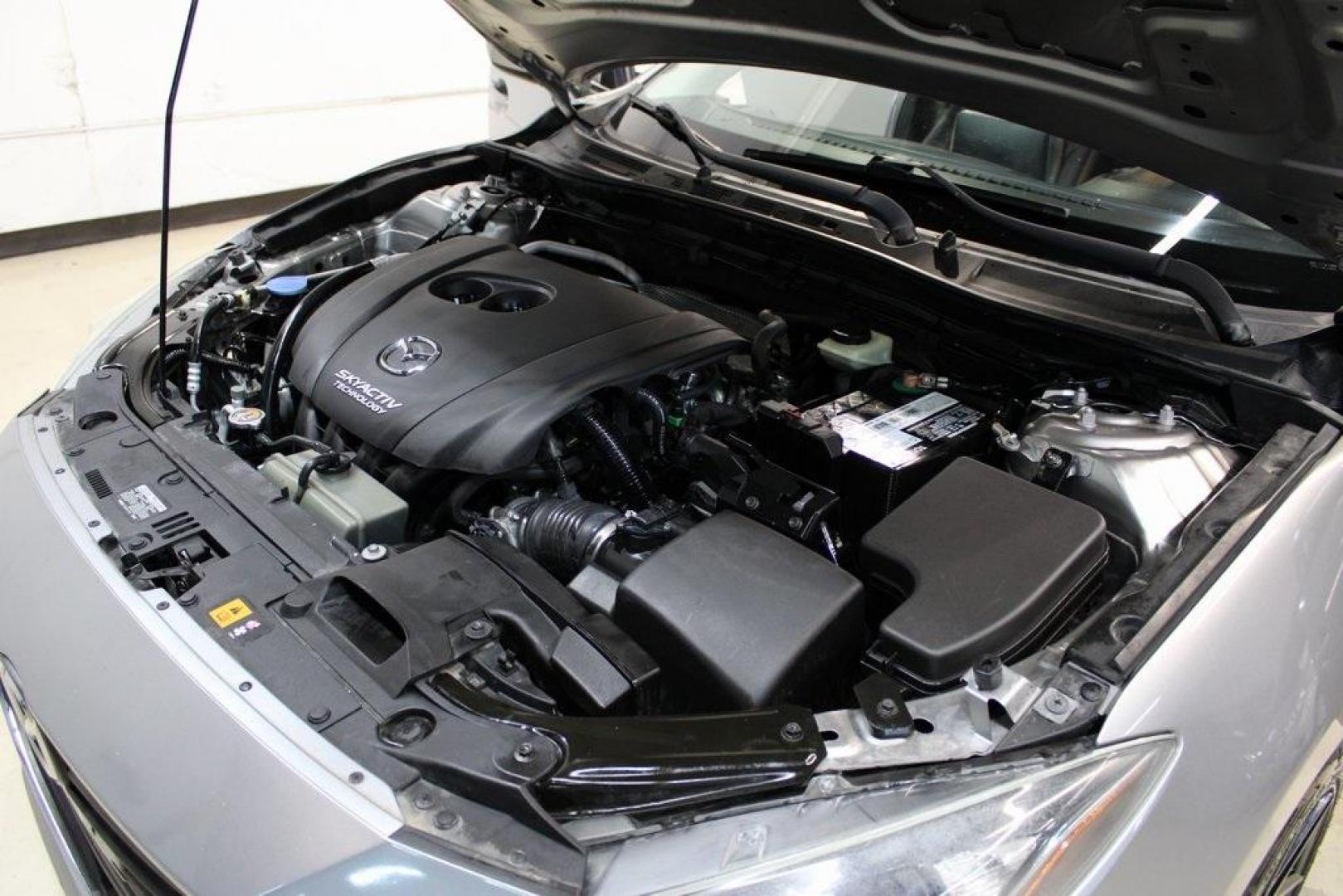 2015 Liquid Silver Metallic /Black Mazda Mazda3 i Grand Touring (3MZBM1M74FM) with an SKYACTIV-G 2.0L 4-Cylinder DOHC 16V engine, Manual transmission, located at 15300 Midway Rd., Addison, TX, 75001, (972) 702-0011, 32.958321, -96.838074 - Photo#30