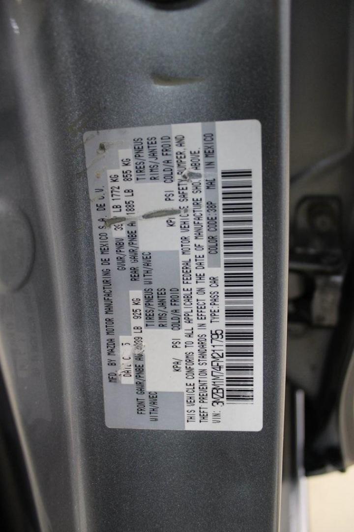 2015 Liquid Silver Metallic /Black Mazda Mazda3 i Grand Touring (3MZBM1M74FM) with an SKYACTIV-G 2.0L 4-Cylinder DOHC 16V engine, Manual transmission, located at 15300 Midway Rd., Addison, TX, 75001, (972) 702-0011, 32.958321, -96.838074 - Photo#31