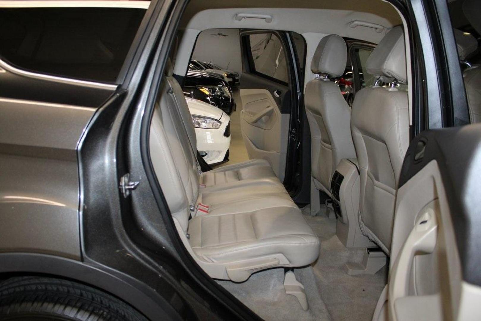 2015 Magnetic /Medium Light Stone Ford Escape SE (1FMCU0GXXFU) with an EcoBoost 1.6L I4 GTDi DOHC Turbocharged VCT engine, Automatic transmission, located at 15300 Midway Rd., Addison, TX, 75001, (972) 702-0011, 32.958321, -96.838074 - 2015 Ford Escape SE<br>Now Available at Midway Auto Group Addison, Texas<br><br>Sporty, practical, and fuel-efficient, the 2015 Ford Escape SE offers everything you want in a compact SUVresponsive handling, flexible cargo space, and modern technology. Whether you're navigating daily errands in Addi - Photo#16