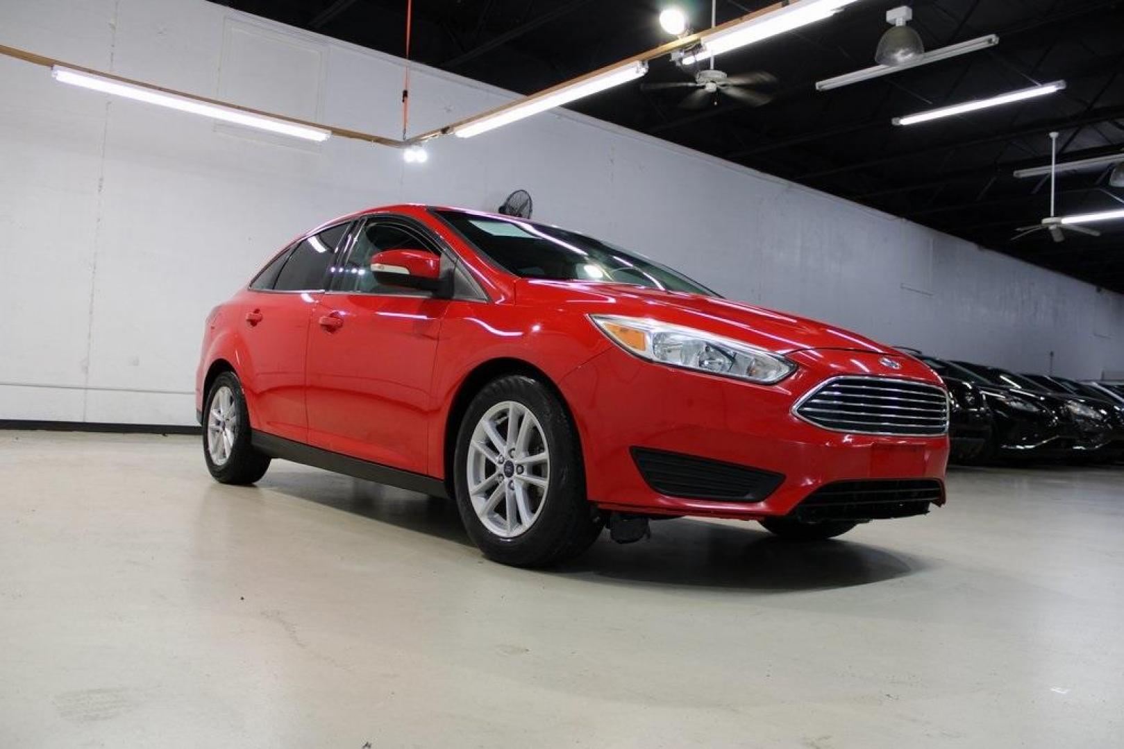 2017 Race Red /Charcoal Black Ford Focus SE (1FADP3F23HL) with an 2.0L 4-Cylinder DGI Flex Fuel Turbocharged DOHC engine, Automatic transmission, located at 15300 Midway Rd., Addison, TX, 75001, (972) 702-0011, 32.958321, -96.838074 - ''2017 Ford Focus SE<br>Now Available at Midway Auto Group Addison, Texas<br><br>Affordable, efficient, and well-equipped, the 2017 Ford Focus SE is a smart choice for anyone looking for a reliable compact sedan with style and substance. Whether you're commuting through Addison or cruising the open - Photo#1