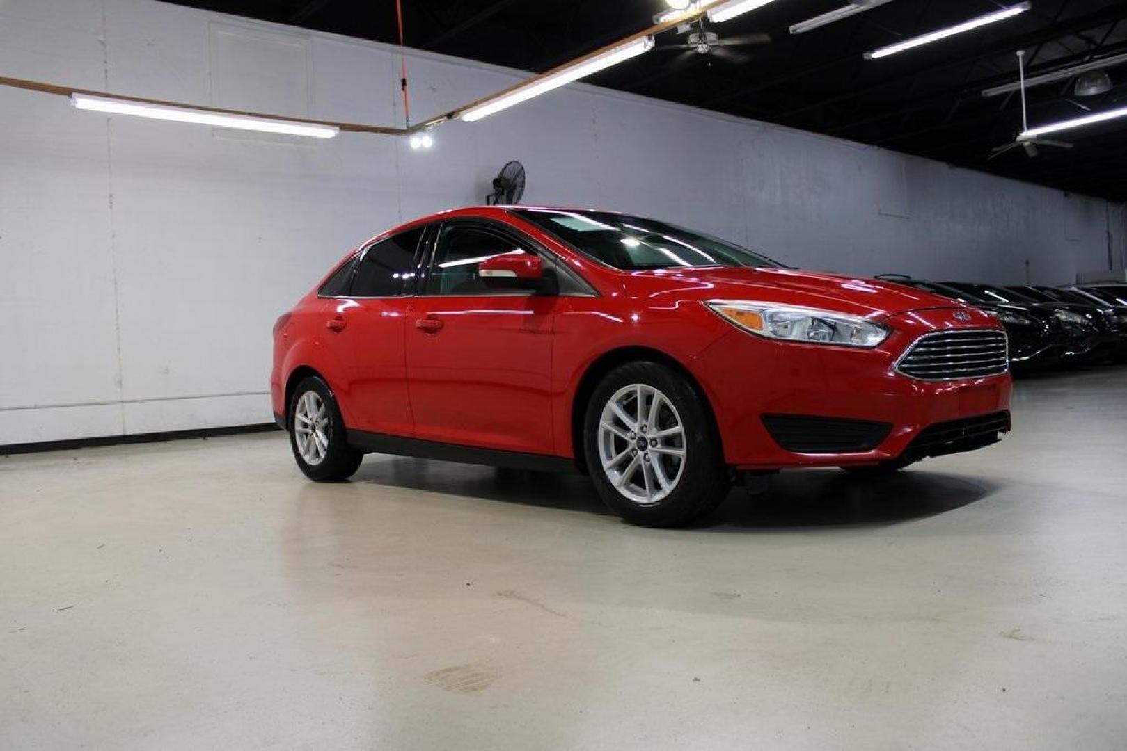 2017 Race Red /Charcoal Black Ford Focus SE (1FADP3F23HL) with an 2.0L 4-Cylinder DGI Flex Fuel Turbocharged DOHC engine, Automatic transmission, located at 15300 Midway Rd., Addison, TX, 75001, (972) 702-0011, 32.958321, -96.838074 - ''2017 Ford Focus SE<br>Now Available at Midway Auto Group Addison, Texas<br><br>Affordable, efficient, and well-equipped, the 2017 Ford Focus SE is a smart choice for anyone looking for a reliable compact sedan with style and substance. Whether you're commuting through Addison or cruising the open - Photo#6