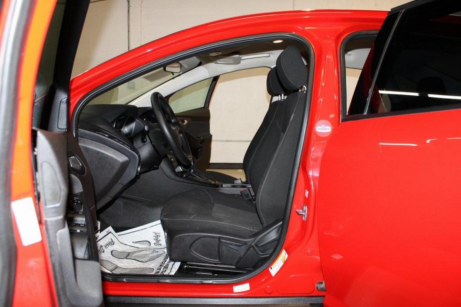 2017 Race Red /Charcoal Black Ford Focus SE (1FADP3F23HL) with an 2.0L 4-Cylinder DGI Flex Fuel Turbocharged DOHC engine, Automatic transmission, located at 15300 Midway Rd., Addison, TX, 75001, (972) 702-0011, 32.958321, -96.838074 - ''2017 Ford Focus SE<br>Now Available at Midway Auto Group Addison, Texas<br><br>Affordable, efficient, and well-equipped, the 2017 Ford Focus SE is a smart choice for anyone looking for a reliable compact sedan with style and substance. Whether you're commuting through Addison or cruising the open - Photo#12