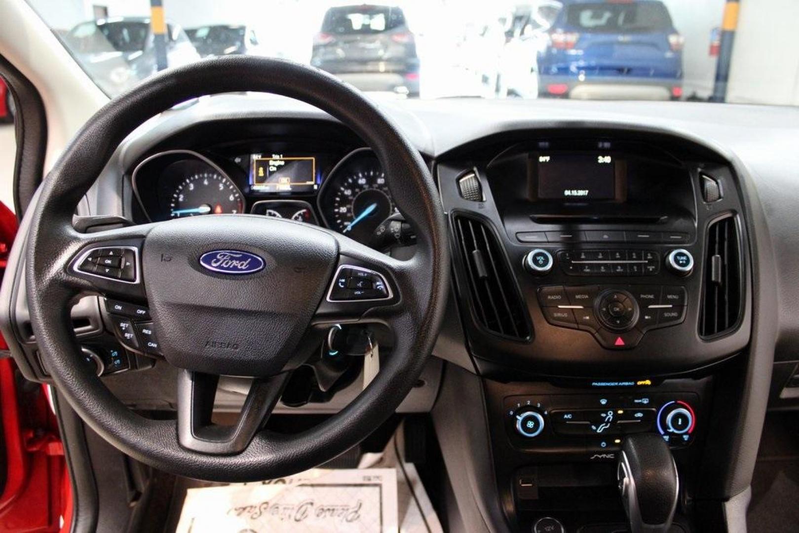 2017 Race Red /Charcoal Black Ford Focus SE (1FADP3F23HL) with an 2.0L 4-Cylinder DGI Flex Fuel Turbocharged DOHC engine, Automatic transmission, located at 15300 Midway Rd., Addison, TX, 75001, (972) 702-0011, 32.958321, -96.838074 - ''2017 Ford Focus SE<br>Now Available at Midway Auto Group Addison, Texas<br><br>Affordable, efficient, and well-equipped, the 2017 Ford Focus SE is a smart choice for anyone looking for a reliable compact sedan with style and substance. Whether you're commuting through Addison or cruising the open - Photo#16