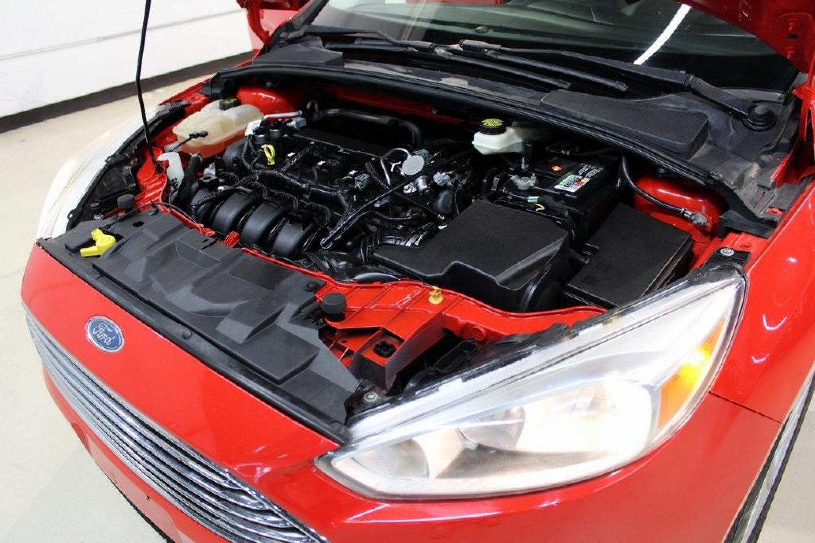 2017 Race Red /Charcoal Black Ford Focus SE (1FADP3F23HL) with an 2.0L 4-Cylinder DGI Flex Fuel Turbocharged DOHC engine, Automatic transmission, located at 15300 Midway Rd., Addison, TX, 75001, (972) 702-0011, 32.958321, -96.838074 - ''2017 Ford Focus SE<br>Now Available at Midway Auto Group Addison, Texas<br><br>Affordable, efficient, and well-equipped, the 2017 Ford Focus SE is a smart choice for anyone looking for a reliable compact sedan with style and substance. Whether you're commuting through Addison or cruising the open - Photo#28