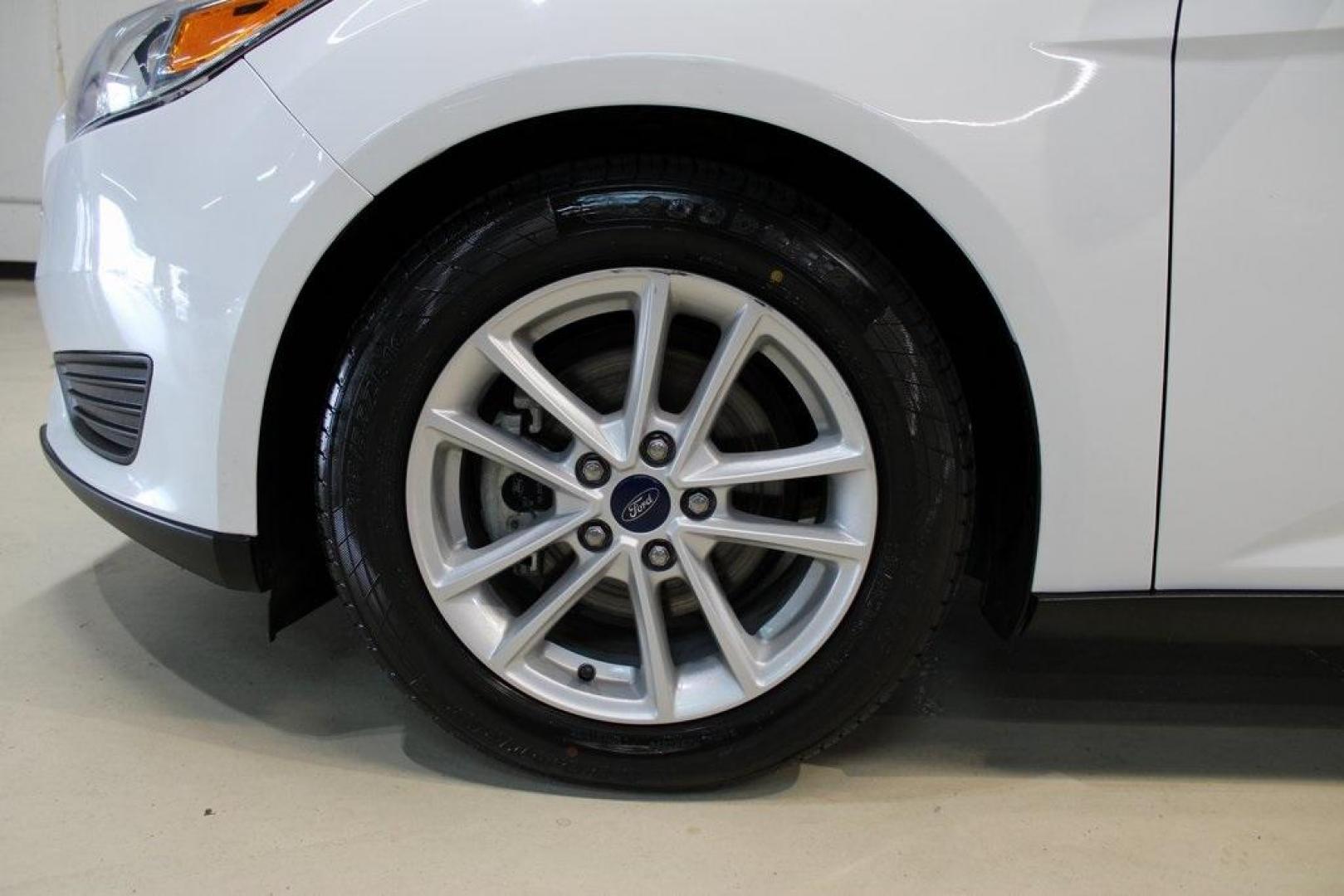 2018 Oxford White /Charcoal Black Ford Focus SE (1FADP3F29JL) with an 2.0L I4 DGI Ti-VCT engine, Automatic transmission, located at 15300 Midway Rd., Addison, TX, 75001, (972) 702-0011, 32.958321, -96.838074 - 2018 Ford Focus SE<br>Now Available at Midway Auto Group Addison, Texas<br><br>Compact, efficient, and packed with value, the 2018 Ford Focus SE offers a smart balance of fuel economy, comfort, and modern features. Whether you're commuting through Addison or navigating city streets across the DFW m - Photo#7