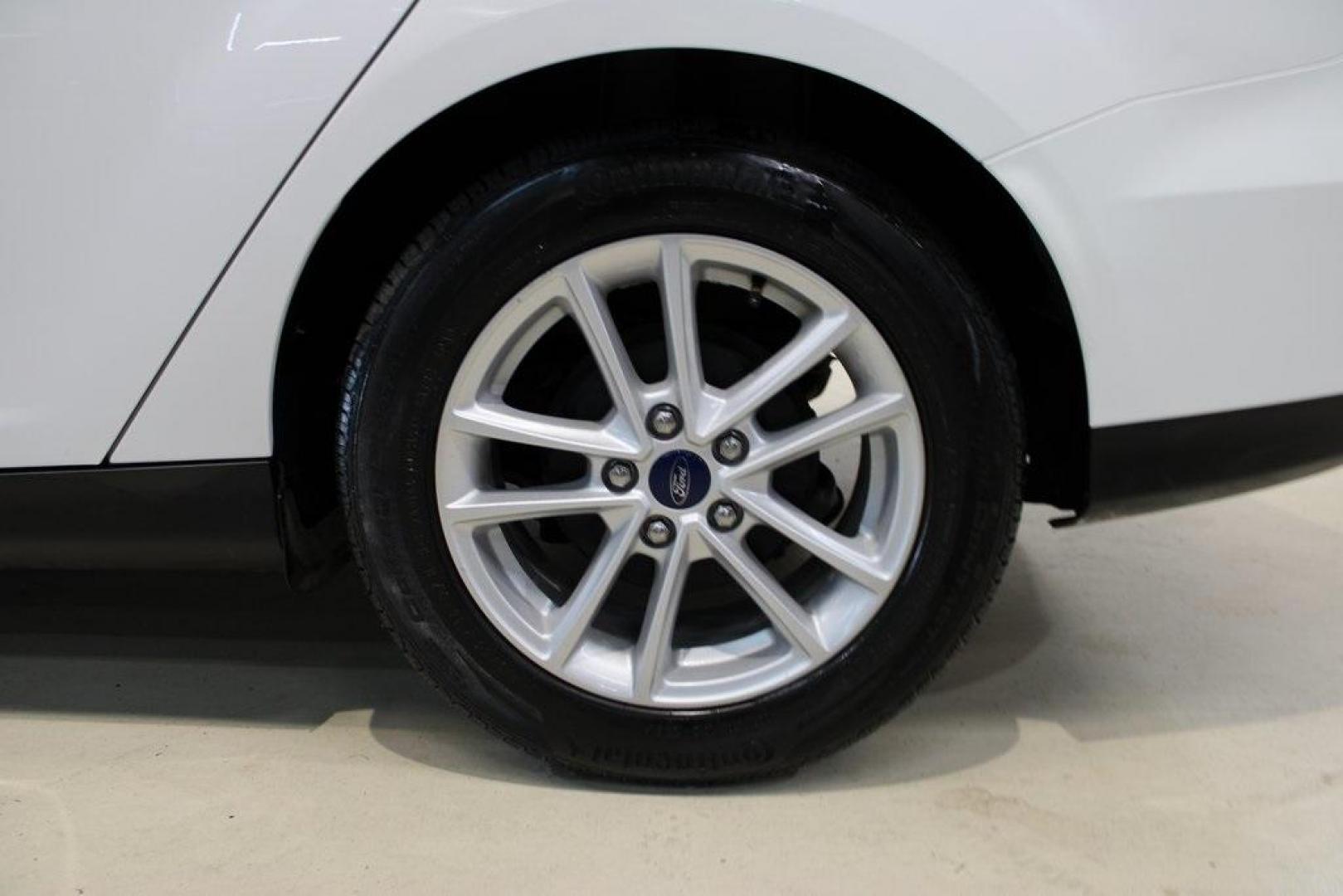 2018 Oxford White /Charcoal Black Ford Focus SE (1FADP3F29JL) with an 2.0L I4 DGI Ti-VCT engine, Automatic transmission, located at 15300 Midway Rd., Addison, TX, 75001, (972) 702-0011, 32.958321, -96.838074 - 2018 Ford Focus SE<br>Now Available at Midway Auto Group Addison, Texas<br><br>Compact, efficient, and packed with value, the 2018 Ford Focus SE offers a smart balance of fuel economy, comfort, and modern features. Whether you're commuting through Addison or navigating city streets across the DFW m - Photo#8