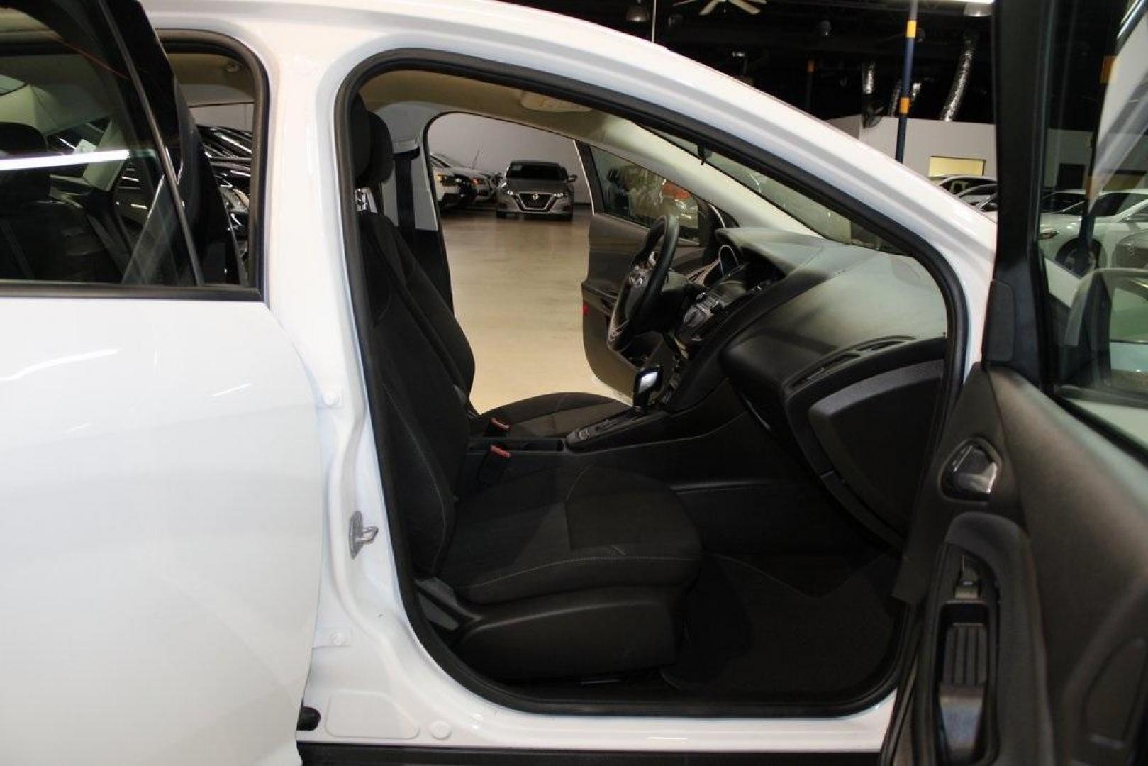 2018 Oxford White /Charcoal Black Ford Focus SE (1FADP3F29JL) with an 2.0L I4 DGI Ti-VCT engine, Automatic transmission, located at 15300 Midway Rd., Addison, TX, 75001, (972) 702-0011, 32.958321, -96.838074 - 2018 Ford Focus SE<br>Now Available at Midway Auto Group Addison, Texas<br><br>Compact, efficient, and packed with value, the 2018 Ford Focus SE offers a smart balance of fuel economy, comfort, and modern features. Whether you're commuting through Addison or navigating city streets across the DFW m - Photo#11