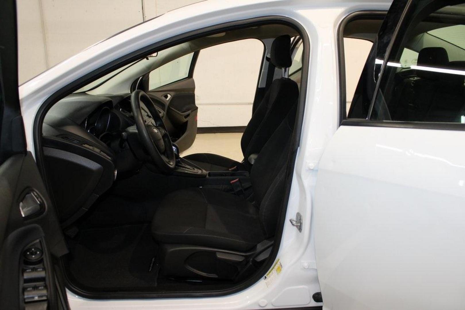 2018 Oxford White /Charcoal Black Ford Focus SE (1FADP3F29JL) with an 2.0L I4 DGI Ti-VCT engine, Automatic transmission, located at 15300 Midway Rd., Addison, TX, 75001, (972) 702-0011, 32.958321, -96.838074 - 2018 Ford Focus SE<br>Now Available at Midway Auto Group Addison, Texas<br><br>Compact, efficient, and packed with value, the 2018 Ford Focus SE offers a smart balance of fuel economy, comfort, and modern features. Whether you're commuting through Addison or navigating city streets across the DFW m - Photo#14