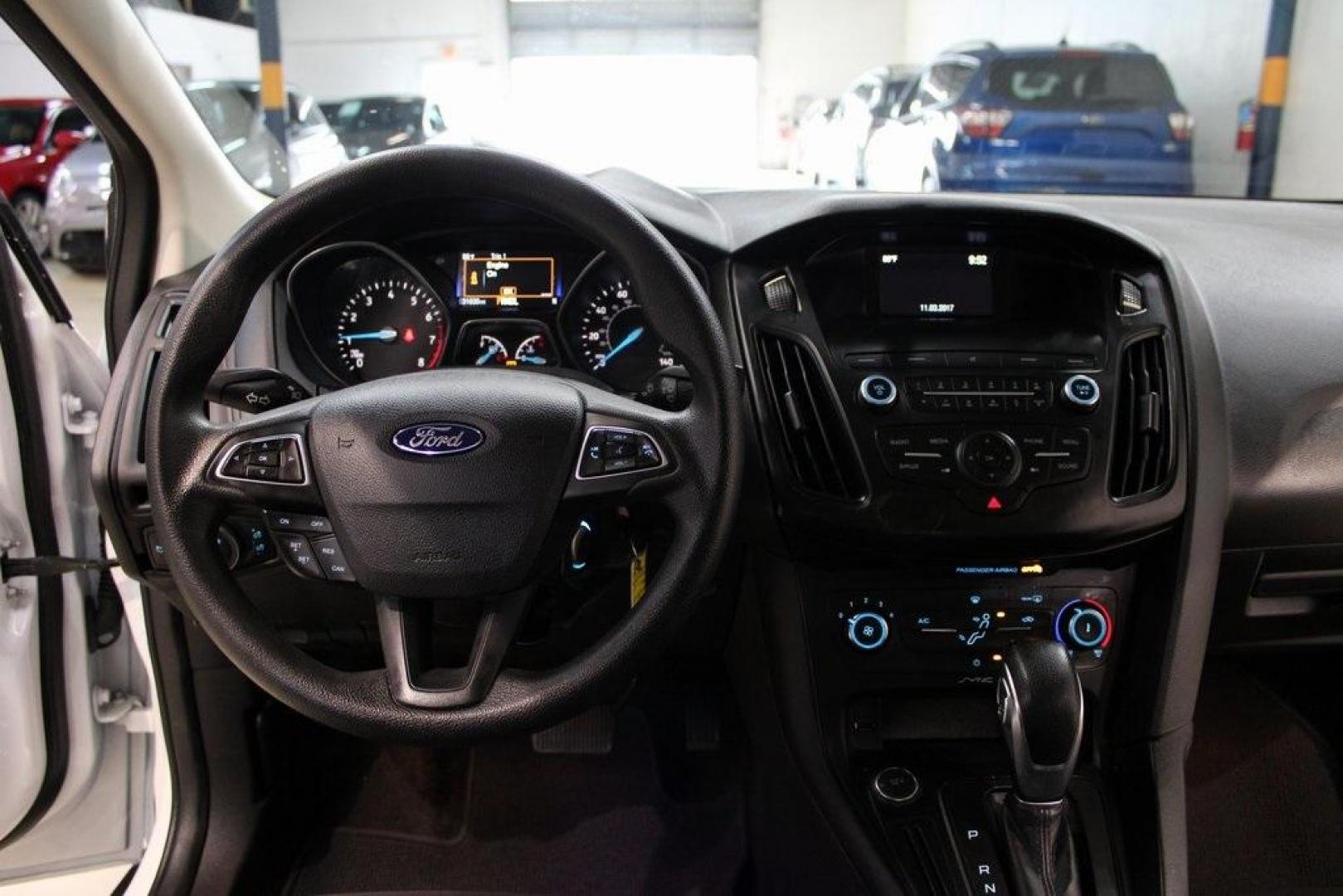 2018 Oxford White /Charcoal Black Ford Focus SE (1FADP3F29JL) with an 2.0L I4 DGI Ti-VCT engine, Automatic transmission, located at 15300 Midway Rd., Addison, TX, 75001, (972) 702-0011, 32.958321, -96.838074 - 2018 Ford Focus SE<br>Now Available at Midway Auto Group Addison, Texas<br><br>Compact, efficient, and packed with value, the 2018 Ford Focus SE offers a smart balance of fuel economy, comfort, and modern features. Whether you're commuting through Addison or navigating city streets across the DFW m - Photo#15