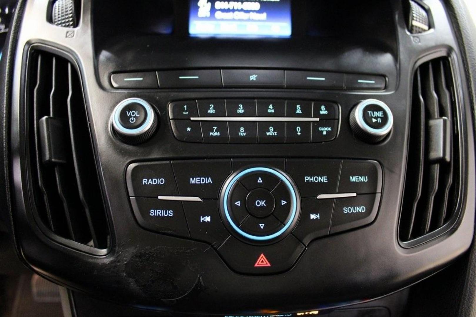 2018 Oxford White /Charcoal Black Ford Focus SE (1FADP3F29JL) with an 2.0L I4 DGI Ti-VCT engine, Automatic transmission, located at 15300 Midway Rd., Addison, TX, 75001, (972) 702-0011, 32.958321, -96.838074 - 2018 Ford Focus SE<br>Now Available at Midway Auto Group Addison, Texas<br><br>Compact, efficient, and packed with value, the 2018 Ford Focus SE offers a smart balance of fuel economy, comfort, and modern features. Whether you're commuting through Addison or navigating city streets across the DFW m - Photo#18