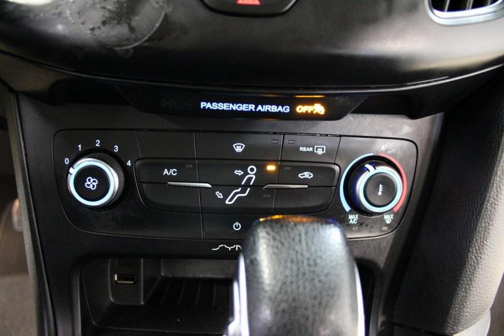2018 Oxford White /Charcoal Black Ford Focus SE (1FADP3F29JL) with an 2.0L I4 DGI Ti-VCT engine, Automatic transmission, located at 15300 Midway Rd., Addison, TX, 75001, (972) 702-0011, 32.958321, -96.838074 - 2018 Ford Focus SE<br>Now Available at Midway Auto Group Addison, Texas<br><br>Compact, efficient, and packed with value, the 2018 Ford Focus SE offers a smart balance of fuel economy, comfort, and modern features. Whether you're commuting through Addison or navigating city streets across the DFW m - Photo#19