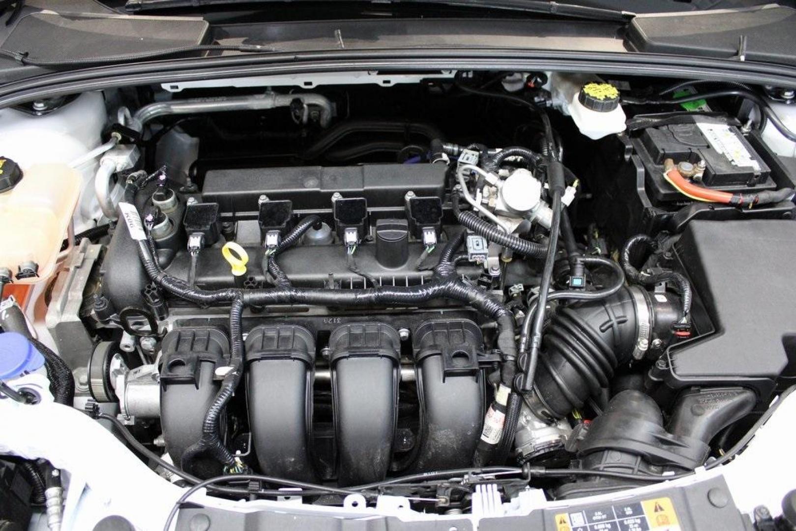 2018 Oxford White /Charcoal Black Ford Focus SE (1FADP3F29JL) with an 2.0L I4 DGI Ti-VCT engine, Automatic transmission, located at 15300 Midway Rd., Addison, TX, 75001, (972) 702-0011, 32.958321, -96.838074 - 2018 Ford Focus SE<br>Now Available at Midway Auto Group Addison, Texas<br><br>Compact, efficient, and packed with value, the 2018 Ford Focus SE offers a smart balance of fuel economy, comfort, and modern features. Whether you're commuting through Addison or navigating city streets across the DFW m - Photo#25