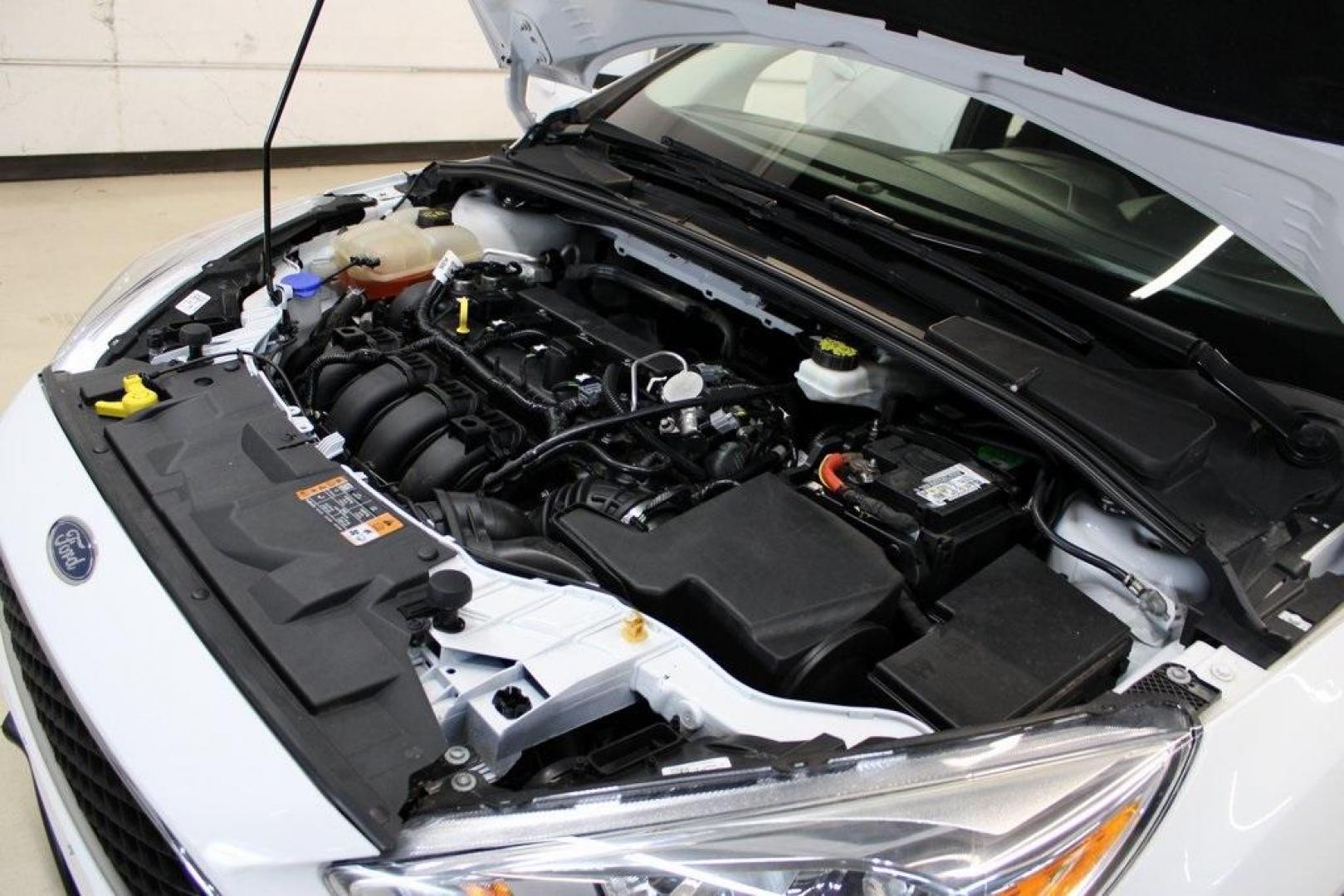 2018 Oxford White /Charcoal Black Ford Focus SE (1FADP3F29JL) with an 2.0L I4 DGI Ti-VCT engine, Automatic transmission, located at 15300 Midway Rd., Addison, TX, 75001, (972) 702-0011, 32.958321, -96.838074 - 2018 Ford Focus SE<br>Now Available at Midway Auto Group Addison, Texas<br><br>Compact, efficient, and packed with value, the 2018 Ford Focus SE offers a smart balance of fuel economy, comfort, and modern features. Whether you're commuting through Addison or navigating city streets across the DFW m - Photo#26