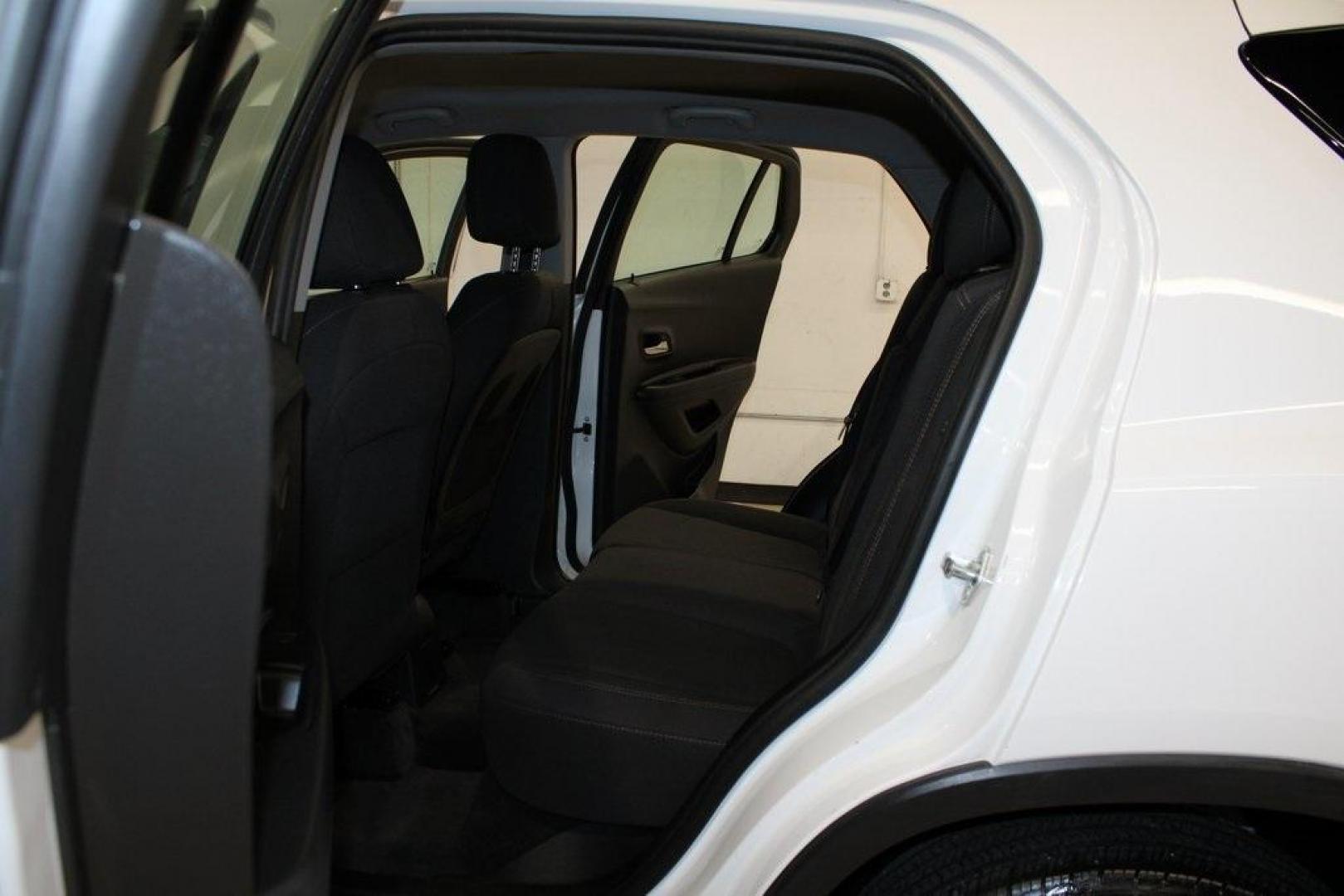 2018 Summit White /Black Chevrolet Trax LS (3GNCJKSB3JL) with an ECOTEC 1.4L I4 SMPI DOHC Turbocharged VVT engine, Automatic transmission, located at 15300 Midway Rd., Addison, TX, 75001, (972) 702-0011, 32.958321, -96.838074 - Photo#15