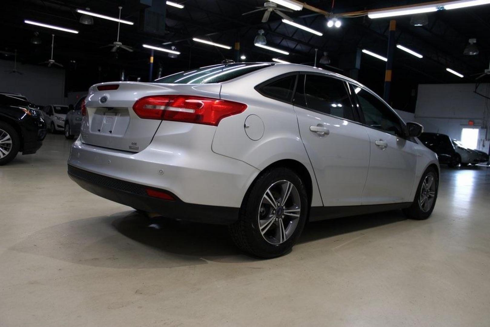 2016 Ingot Silver /Black Ford Focus SE (1FADP3FE5GL) with an EcoBoost 1.0L I3 GTDi DOHC Turbocharged VCT engine, Automatic transmission, located at 15300 Midway Rd., Addison, TX, 75001, (972) 702-0011, 32.958321, -96.838074 - Photo#2