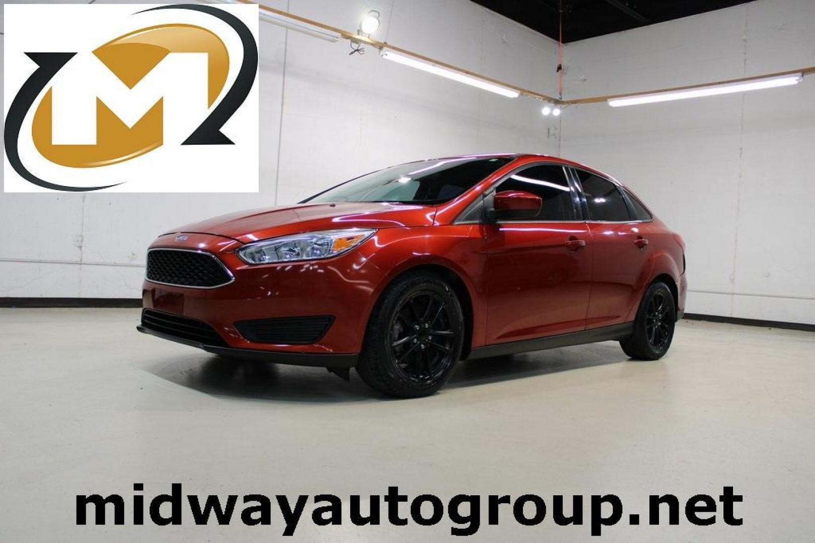 2018 Chili Pepper Red /Charcoal Black Ford Focus SE (1FADP3FE8JL) with an EcoBoost 1.0L I3 GTDi DOHC Turbocharged VCT engine, Automatic transmission, located at 15300 Midway Rd., Addison, TX, 75001, (972) 702-0011, 32.958321, -96.838074 - Photo#0