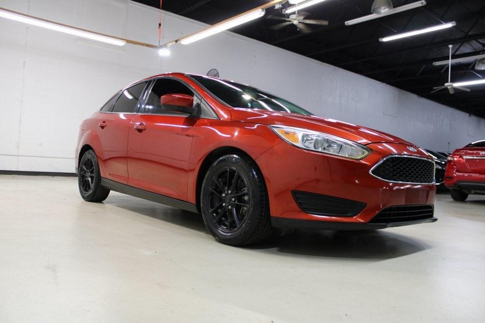 2018 Chili Pepper Red /Charcoal Black Ford Focus SE (1FADP3FE8JL) with an EcoBoost 1.0L I3 GTDi DOHC Turbocharged VCT engine, Automatic transmission, located at 15300 Midway Rd., Addison, TX, 75001, (972) 702-0011, 32.958321, -96.838074 - Photo#1