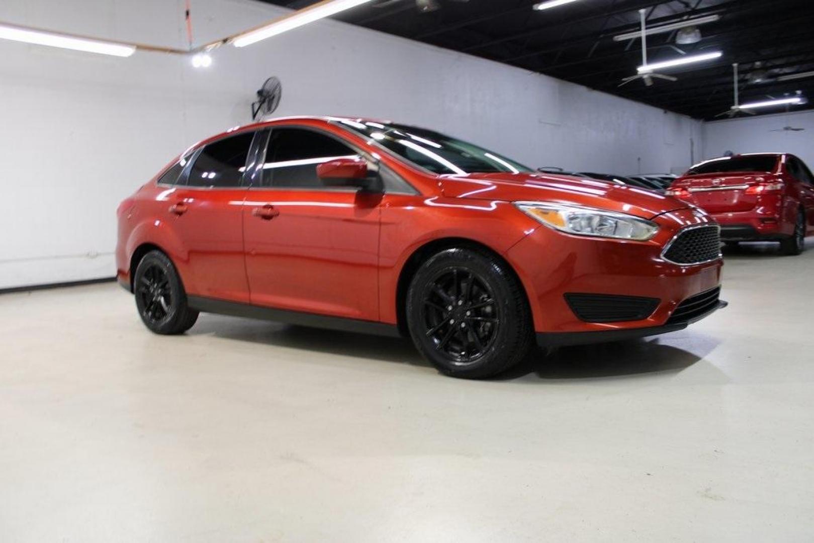 2018 Chili Pepper Red /Charcoal Black Ford Focus SE (1FADP3FE8JL) with an EcoBoost 1.0L I3 GTDi DOHC Turbocharged VCT engine, Automatic transmission, located at 15300 Midway Rd., Addison, TX, 75001, (972) 702-0011, 32.958321, -96.838074 - Photo#6