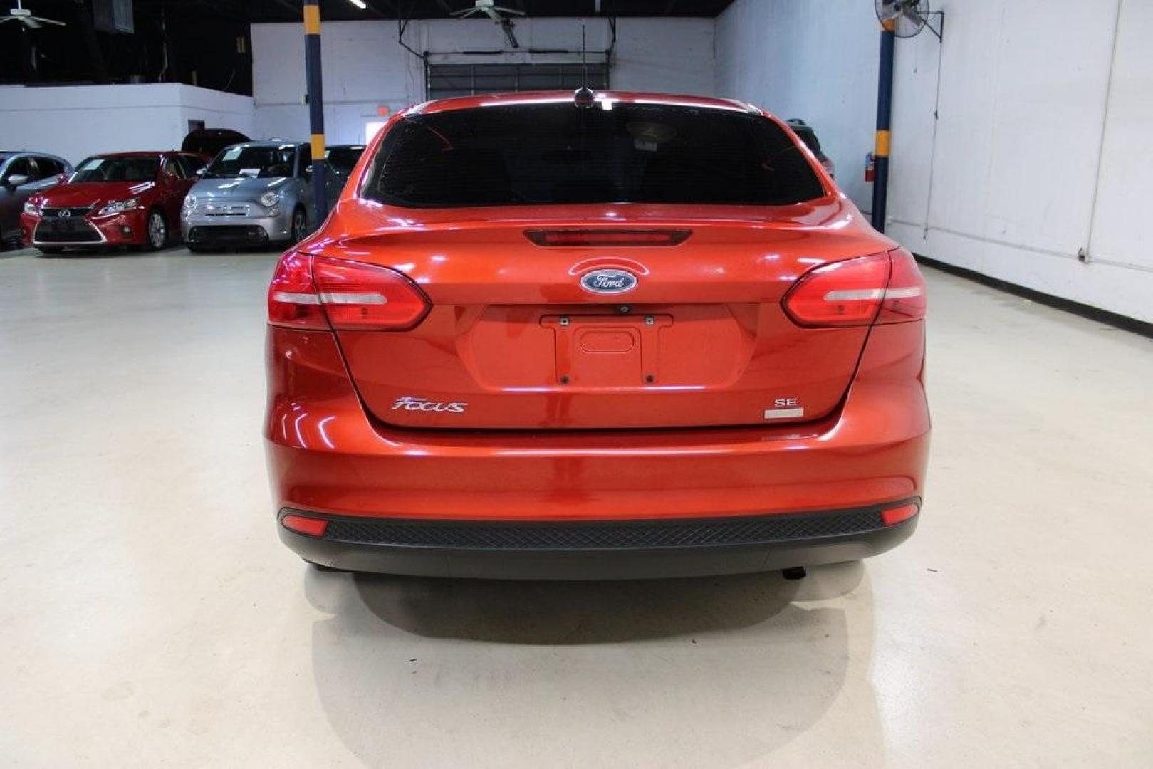 2018 Chili Pepper Red /Charcoal Black Ford Focus SE (1FADP3FE8JL) with an EcoBoost 1.0L I3 GTDi DOHC Turbocharged VCT engine, Automatic transmission, located at 15300 Midway Rd., Addison, TX, 75001, (972) 702-0011, 32.958321, -96.838074 - Photo#7