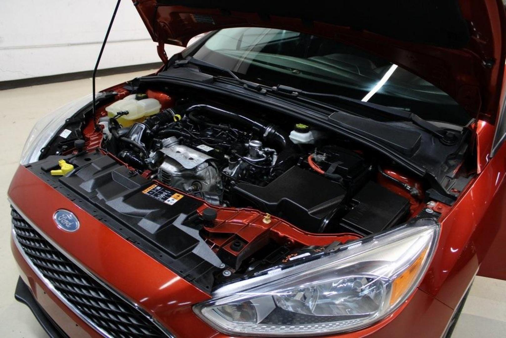 2018 Chili Pepper Red /Charcoal Black Ford Focus SE (1FADP3FE8JL) with an EcoBoost 1.0L I3 GTDi DOHC Turbocharged VCT engine, Automatic transmission, located at 15300 Midway Rd., Addison, TX, 75001, (972) 702-0011, 32.958321, -96.838074 - Photo#29