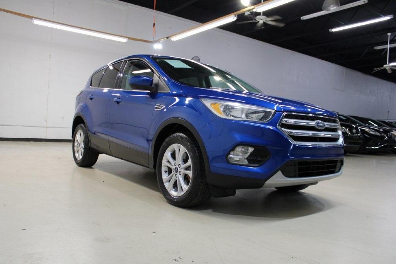 2017 Lightning Blue Metallic /Black Ford Escape SE (1FMCU9GD2HU) with an 1.5L EcoBoost engine, Automatic transmission, located at 15300 Midway Rd., Addison, TX, 75001, (972) 702-0011, 32.958321, -96.838074 - Photo#1