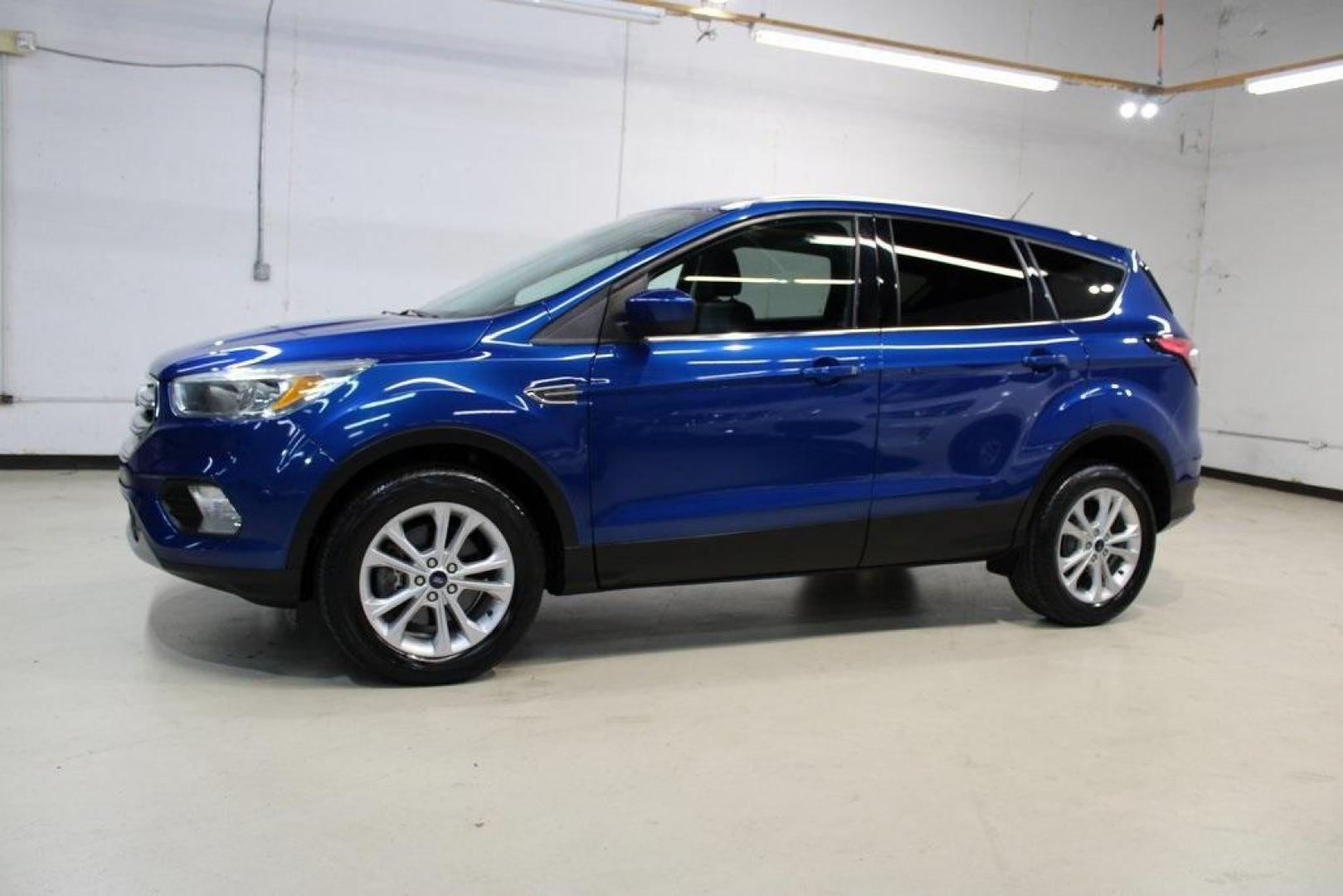 2017 Lightning Blue Metallic /Black Ford Escape SE (1FMCU9GD2HU) with an 1.5L EcoBoost engine, Automatic transmission, located at 15300 Midway Rd., Addison, TX, 75001, (972) 702-0011, 32.958321, -96.838074 - Photo#5