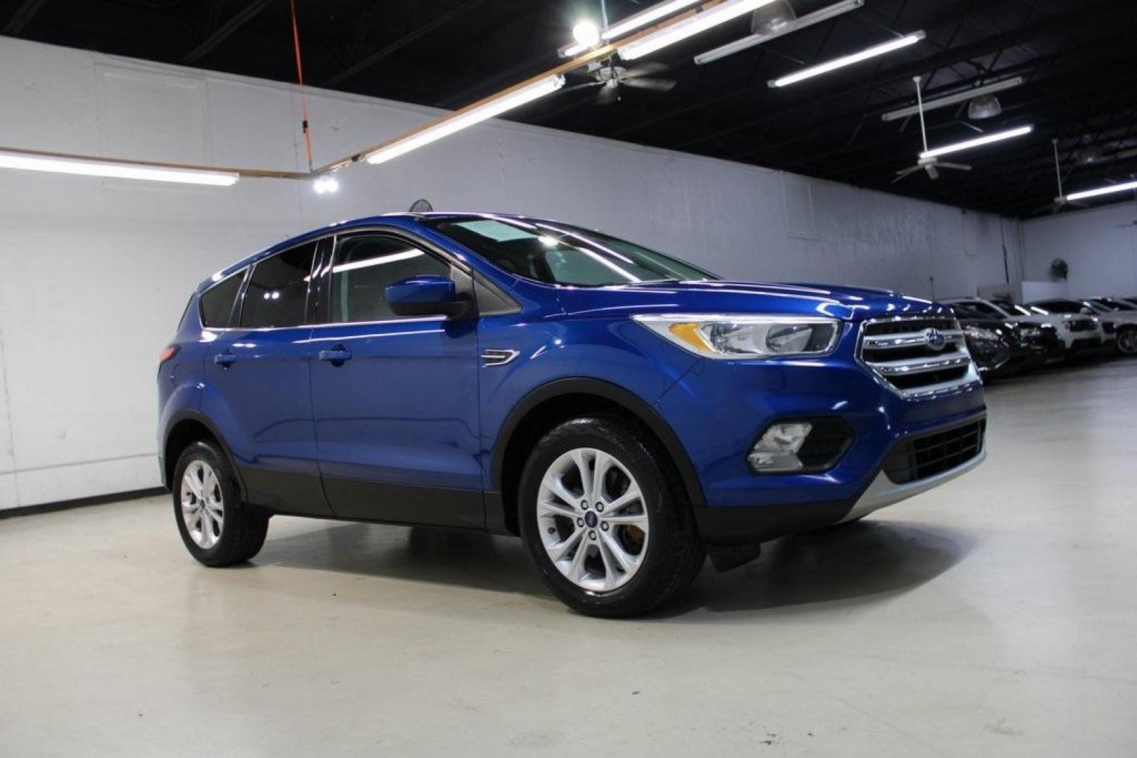 2017 Lightning Blue Metallic /Black Ford Escape SE (1FMCU9GD2HU) with an 1.5L EcoBoost engine, Automatic transmission, located at 15300 Midway Rd., Addison, TX, 75001, (972) 702-0011, 32.958321, -96.838074 - Photo#7