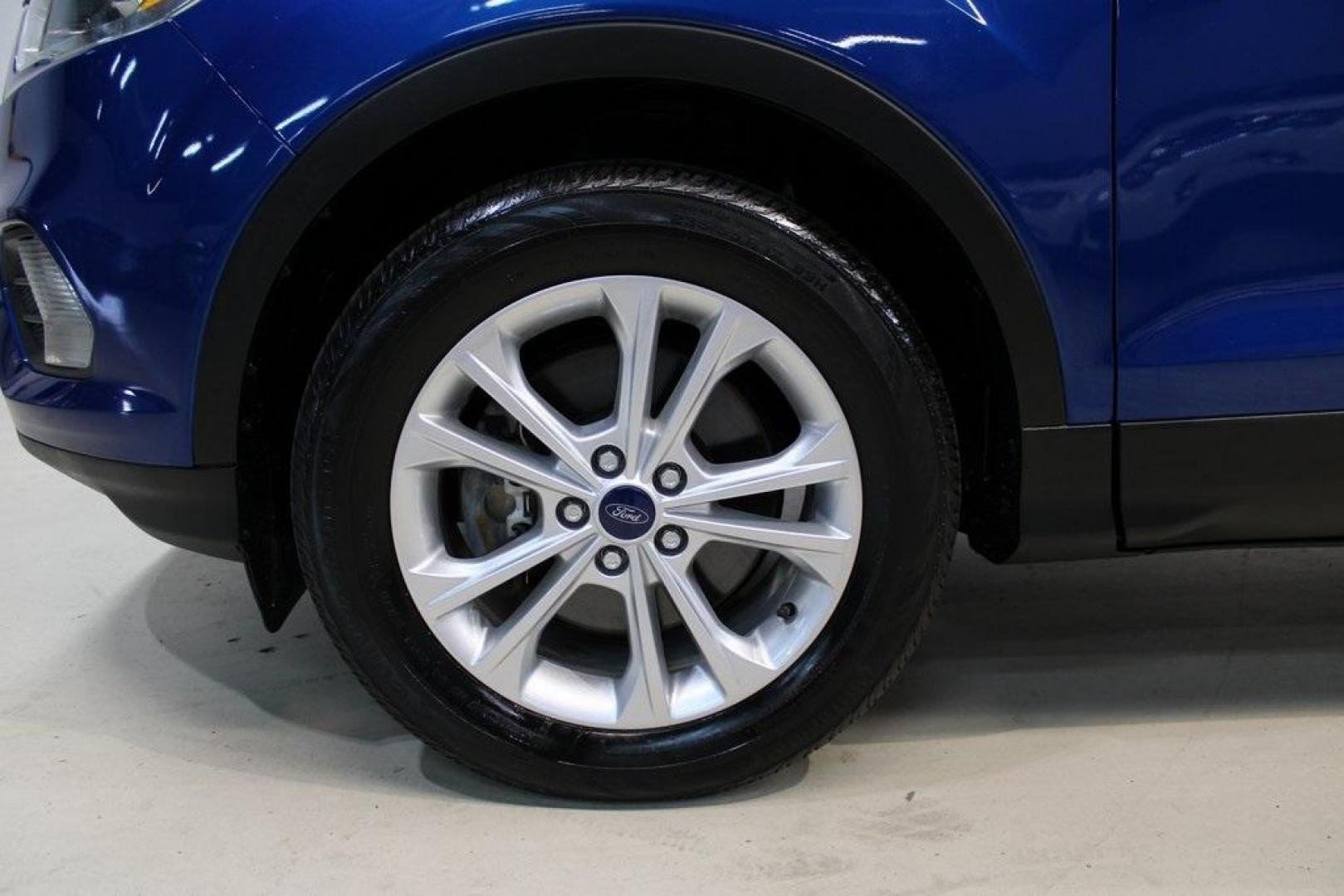 2017 Lightning Blue Metallic /Black Ford Escape SE (1FMCU9GD2HU) with an 1.5L EcoBoost engine, Automatic transmission, located at 15300 Midway Rd., Addison, TX, 75001, (972) 702-0011, 32.958321, -96.838074 - Photo#9