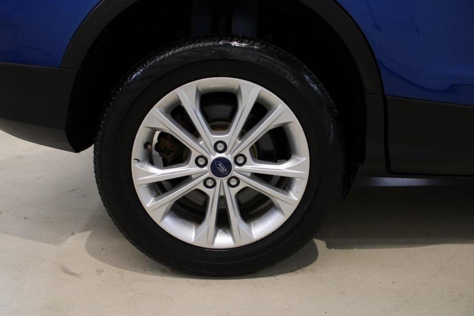 2017 Lightning Blue Metallic /Black Ford Escape SE (1FMCU9GD2HU) with an 1.5L EcoBoost engine, Automatic transmission, located at 15300 Midway Rd., Addison, TX, 75001, (972) 702-0011, 32.958321, -96.838074 - Photo#11