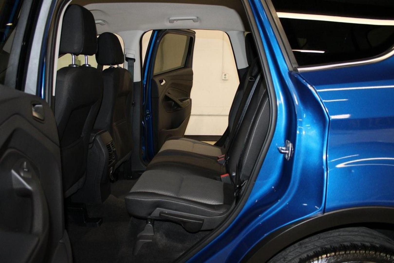 2017 Lightning Blue Metallic /Black Ford Escape SE (1FMCU9GD2HU) with an 1.5L EcoBoost engine, Automatic transmission, located at 15300 Midway Rd., Addison, TX, 75001, (972) 702-0011, 32.958321, -96.838074 - Photo#17