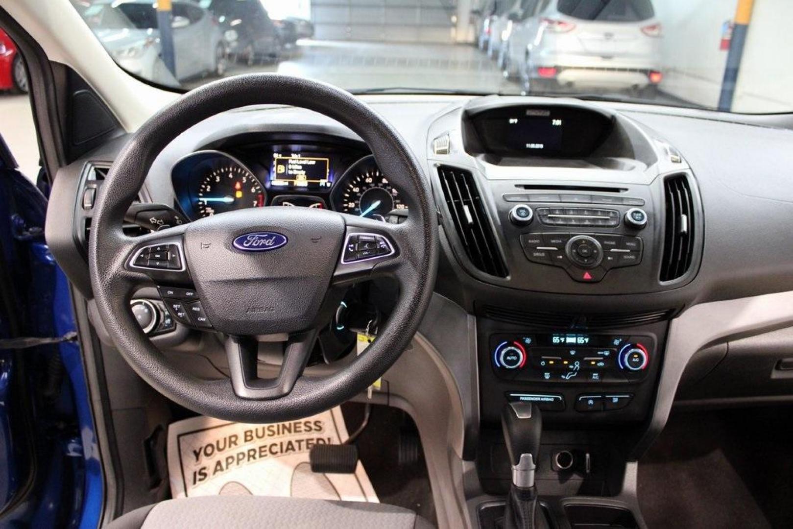 2017 Lightning Blue Metallic /Black Ford Escape SE (1FMCU9GD2HU) with an 1.5L EcoBoost engine, Automatic transmission, located at 15300 Midway Rd., Addison, TX, 75001, (972) 702-0011, 32.958321, -96.838074 - Photo#18