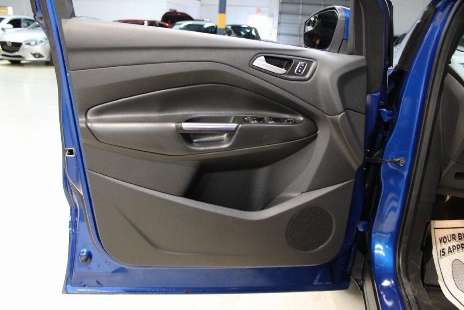 2017 Lightning Blue Metallic /Black Ford Escape SE (1FMCU9GD2HU) with an 1.5L EcoBoost engine, Automatic transmission, located at 15300 Midway Rd., Addison, TX, 75001, (972) 702-0011, 32.958321, -96.838074 - Photo#27