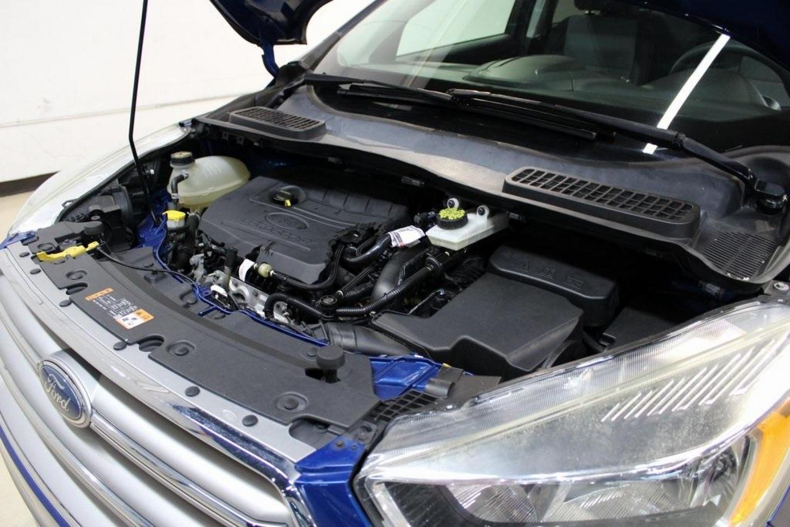 2017 Lightning Blue Metallic /Black Ford Escape SE (1FMCU9GD2HU) with an 1.5L EcoBoost engine, Automatic transmission, located at 15300 Midway Rd., Addison, TX, 75001, (972) 702-0011, 32.958321, -96.838074 - Photo#30