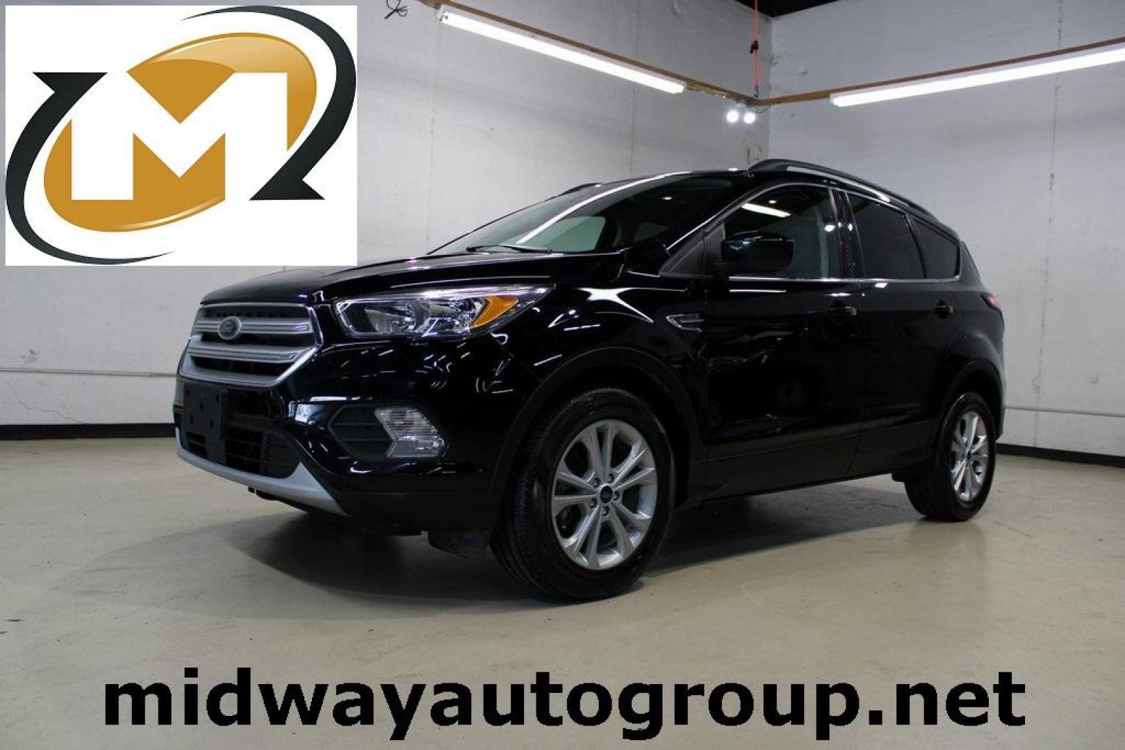 2018 Shadow Black /Medium Light Stone Ford Escape SE (1FMCU0GD3JU) with an EcoBoost 2.0L I4 GTDi DOHC Turbocharged VCT engine, Automatic transmission, located at 15300 Midway Rd., Addison, TX, 75001, (972) 702-0011, 32.958321, -96.838074 - Photo#0