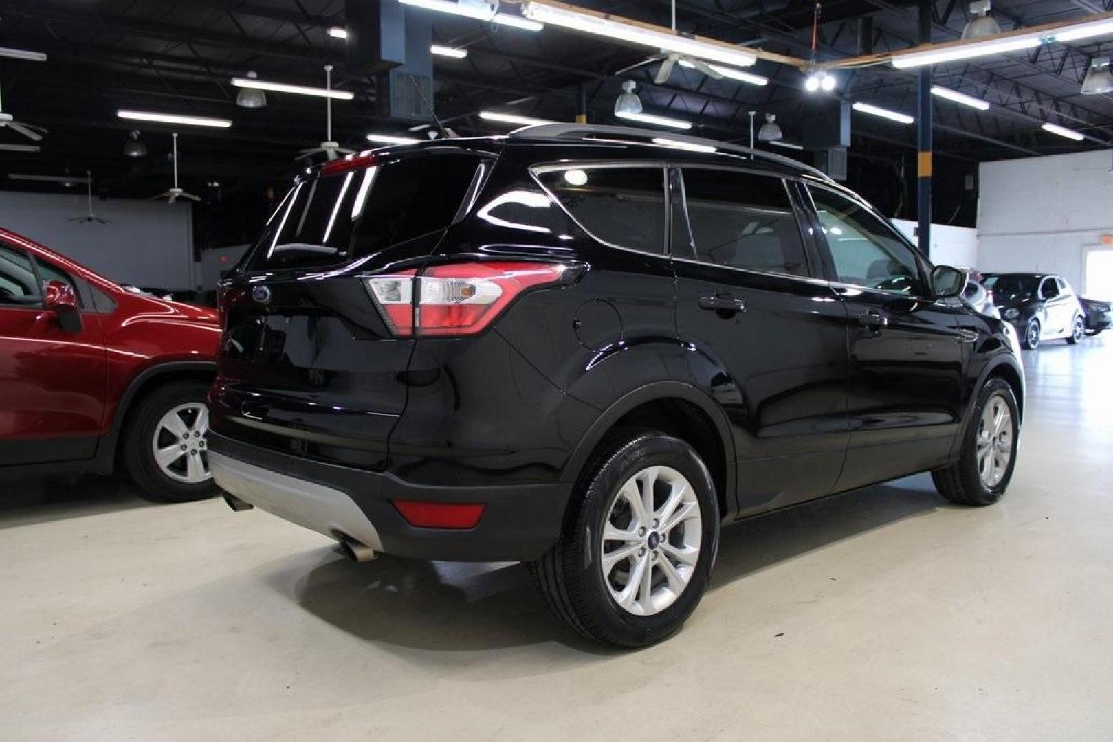 2018 Shadow Black /Medium Light Stone Ford Escape SE (1FMCU0GD3JU) with an EcoBoost 2.0L I4 GTDi DOHC Turbocharged VCT engine, Automatic transmission, located at 15300 Midway Rd., Addison, TX, 75001, (972) 702-0011, 32.958321, -96.838074 - Photo#2