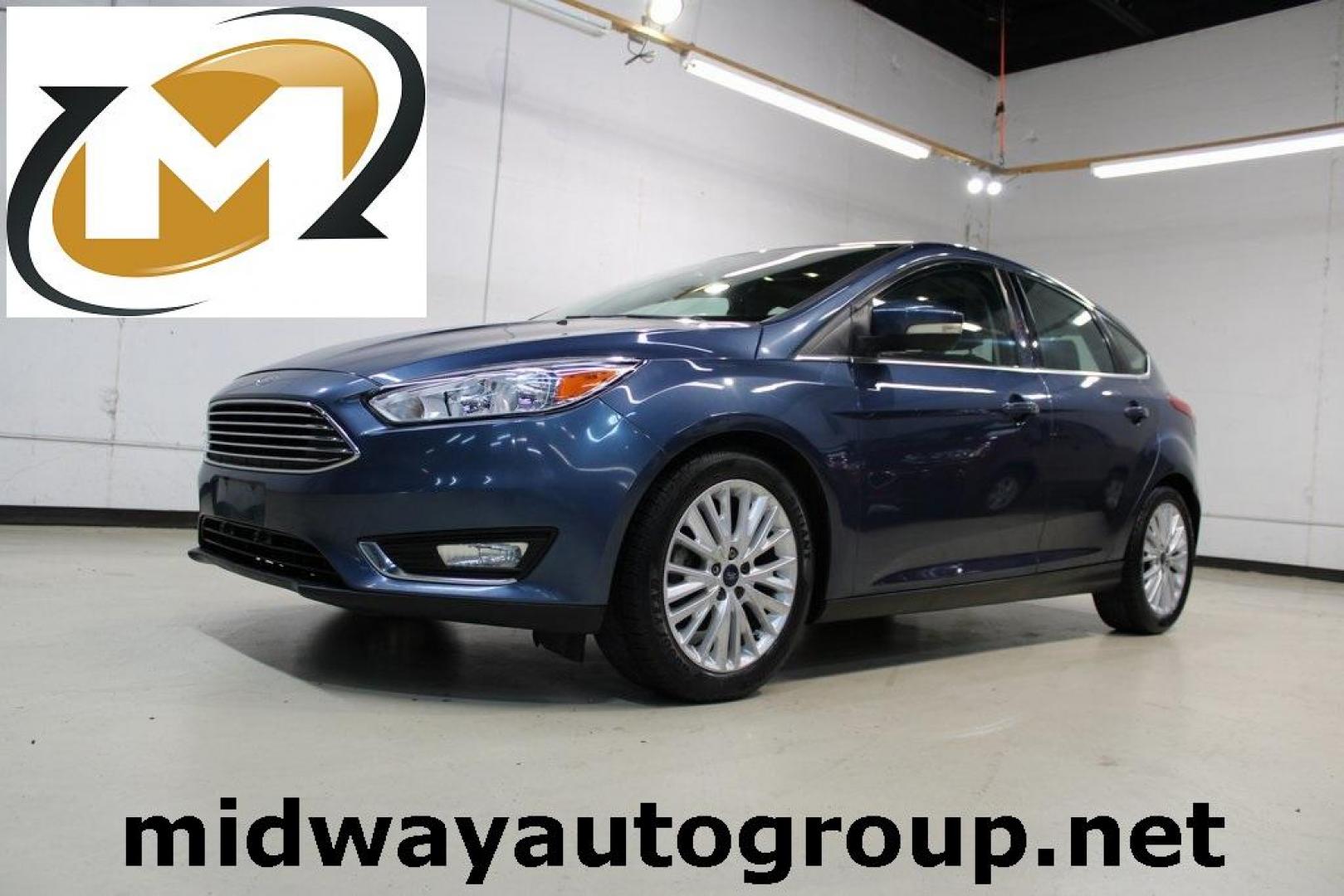 2018 Blue Metallic /Charcoal Black Ford Focus Titanium (1FADP3N28JL) with an 2.0L I4 DGI Ti-VCT engine, Automatic transmission, located at 15300 Midway Rd., Addison, TX, 75001, (972) 702-0011, 32.958321, -96.838074 - Photo#0