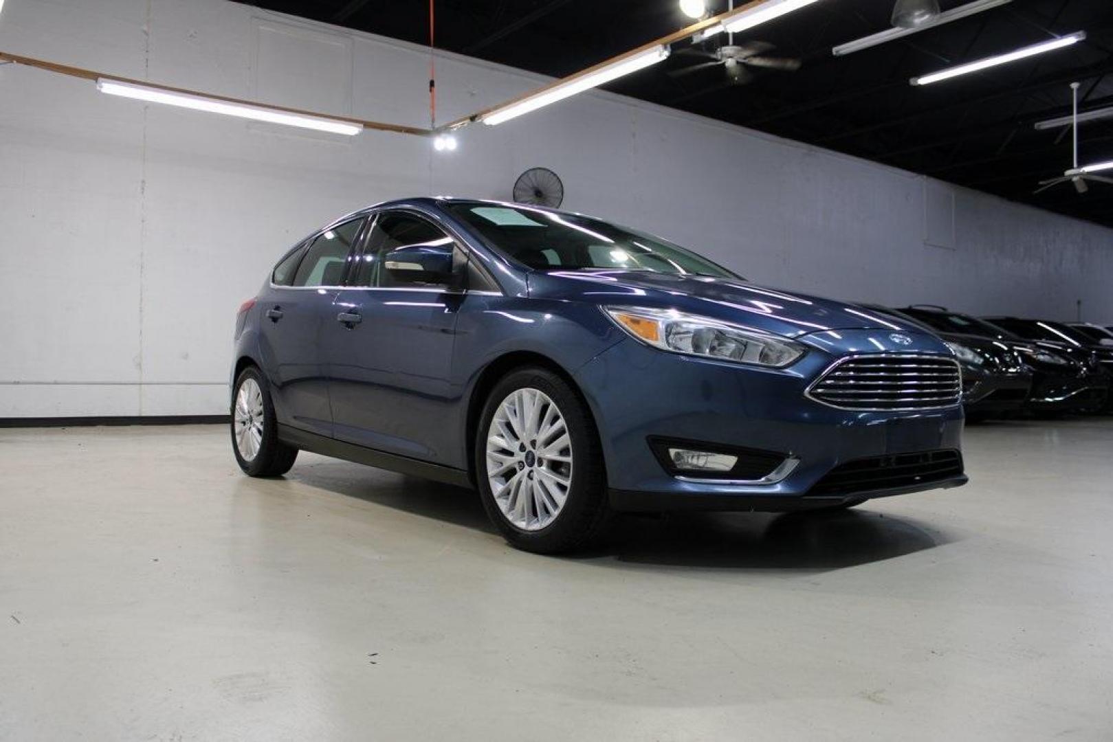 2018 Blue Metallic /Charcoal Black Ford Focus Titanium (1FADP3N28JL) with an 2.0L I4 DGI Ti-VCT engine, Automatic transmission, located at 15300 Midway Rd., Addison, TX, 75001, (972) 702-0011, 32.958321, -96.838074 - Photo#1
