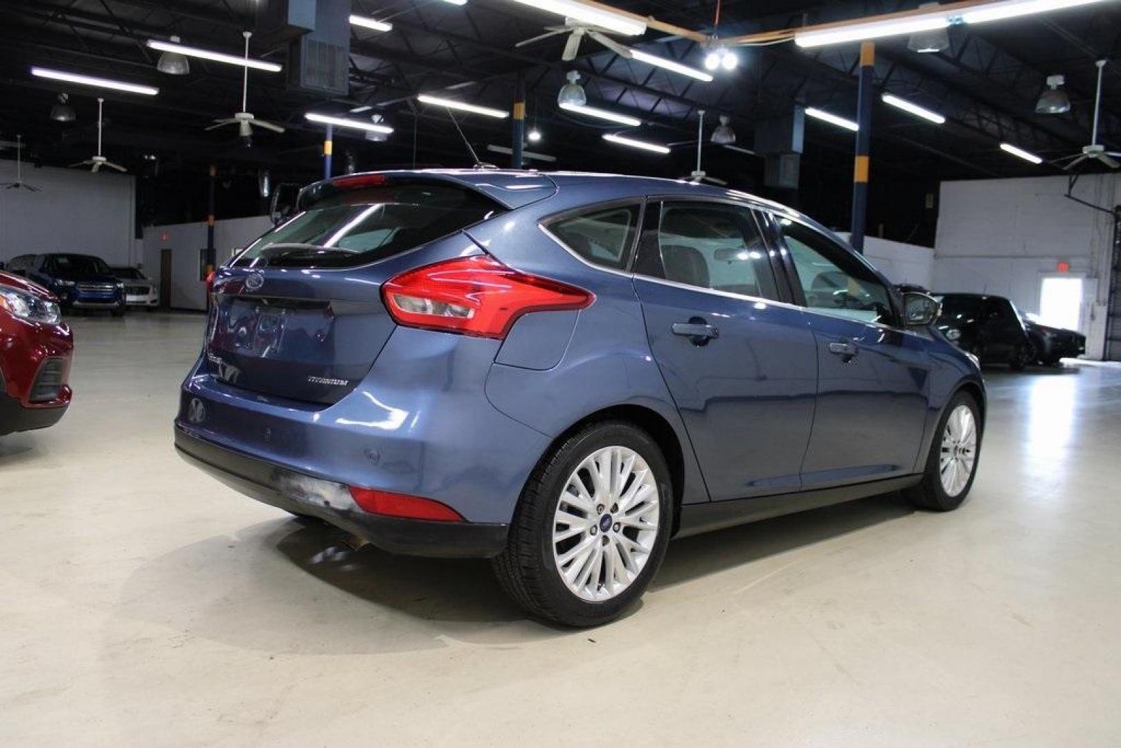 2018 Blue Metallic /Charcoal Black Ford Focus Titanium (1FADP3N28JL) with an 2.0L I4 DGI Ti-VCT engine, Automatic transmission, located at 15300 Midway Rd., Addison, TX, 75001, (972) 702-0011, 32.958321, -96.838074 - Photo#2